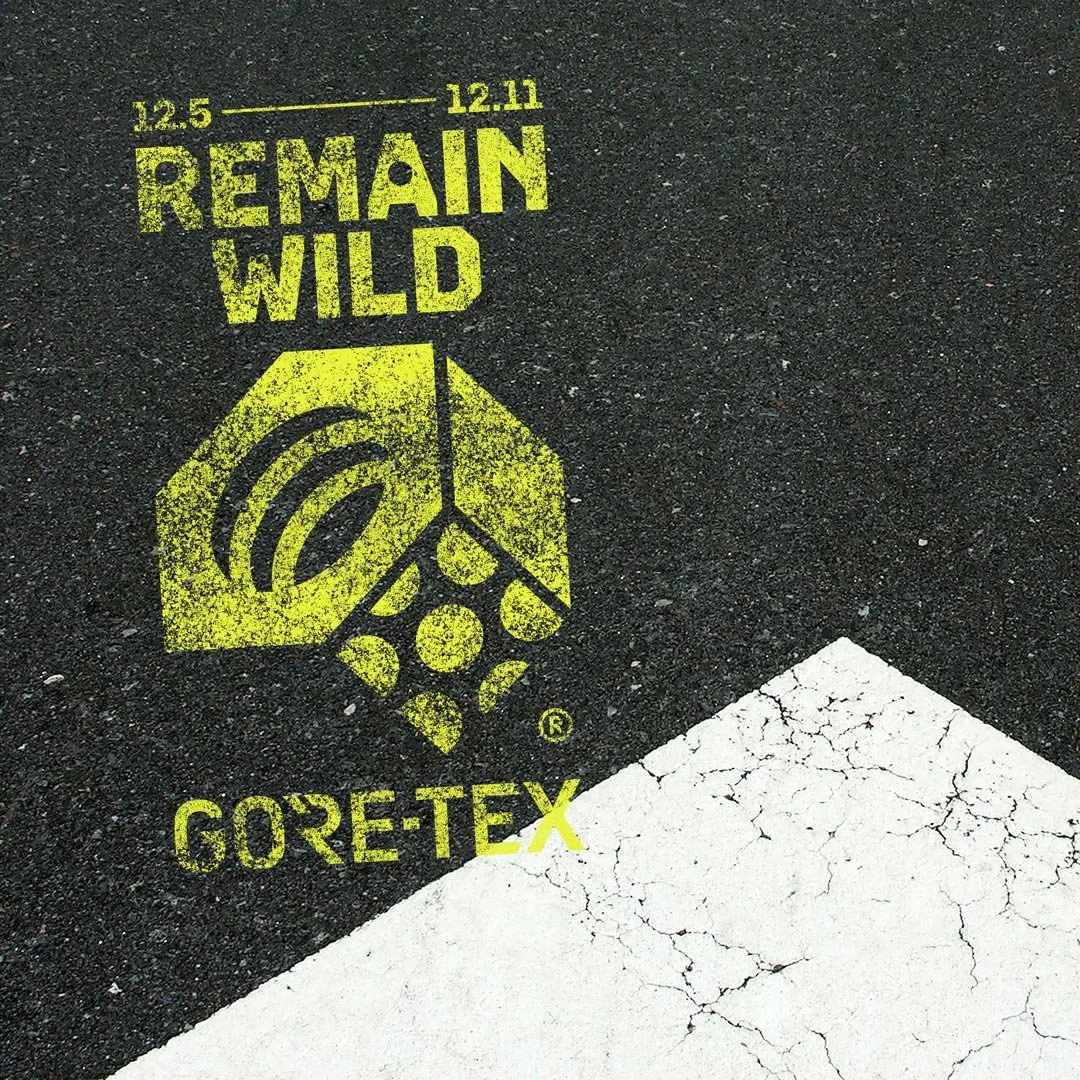 mountain hardwear logo spray painted onto road surface