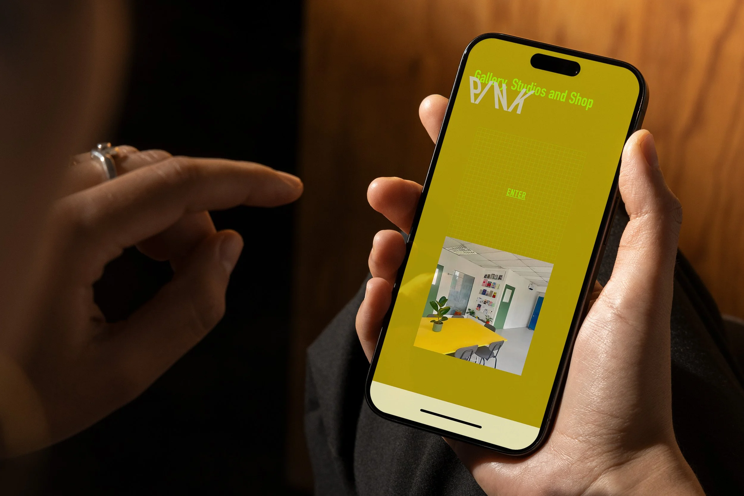 artist exploring gallery website design on phone
