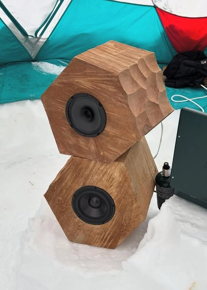 wooden soundsystem sculpture in tent at ski resort