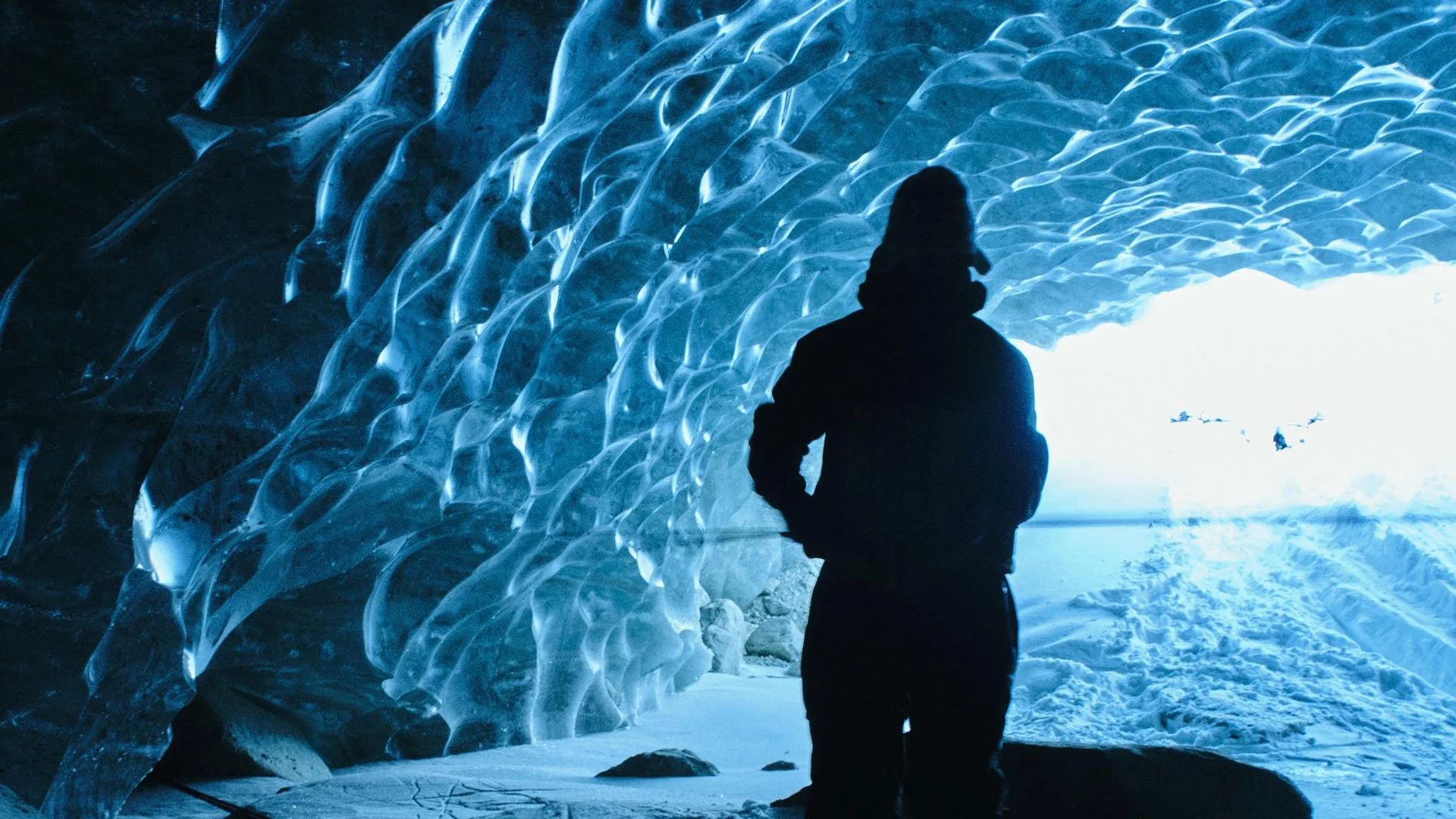 ski athlete sean pettit camping in glacial cave