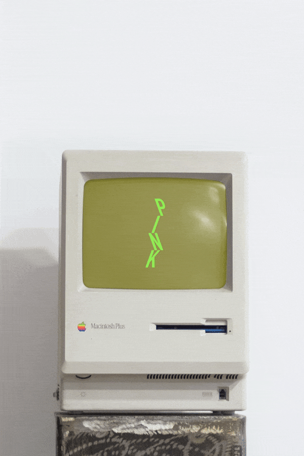 Old apple computer displaying PINK gallery motion graphic