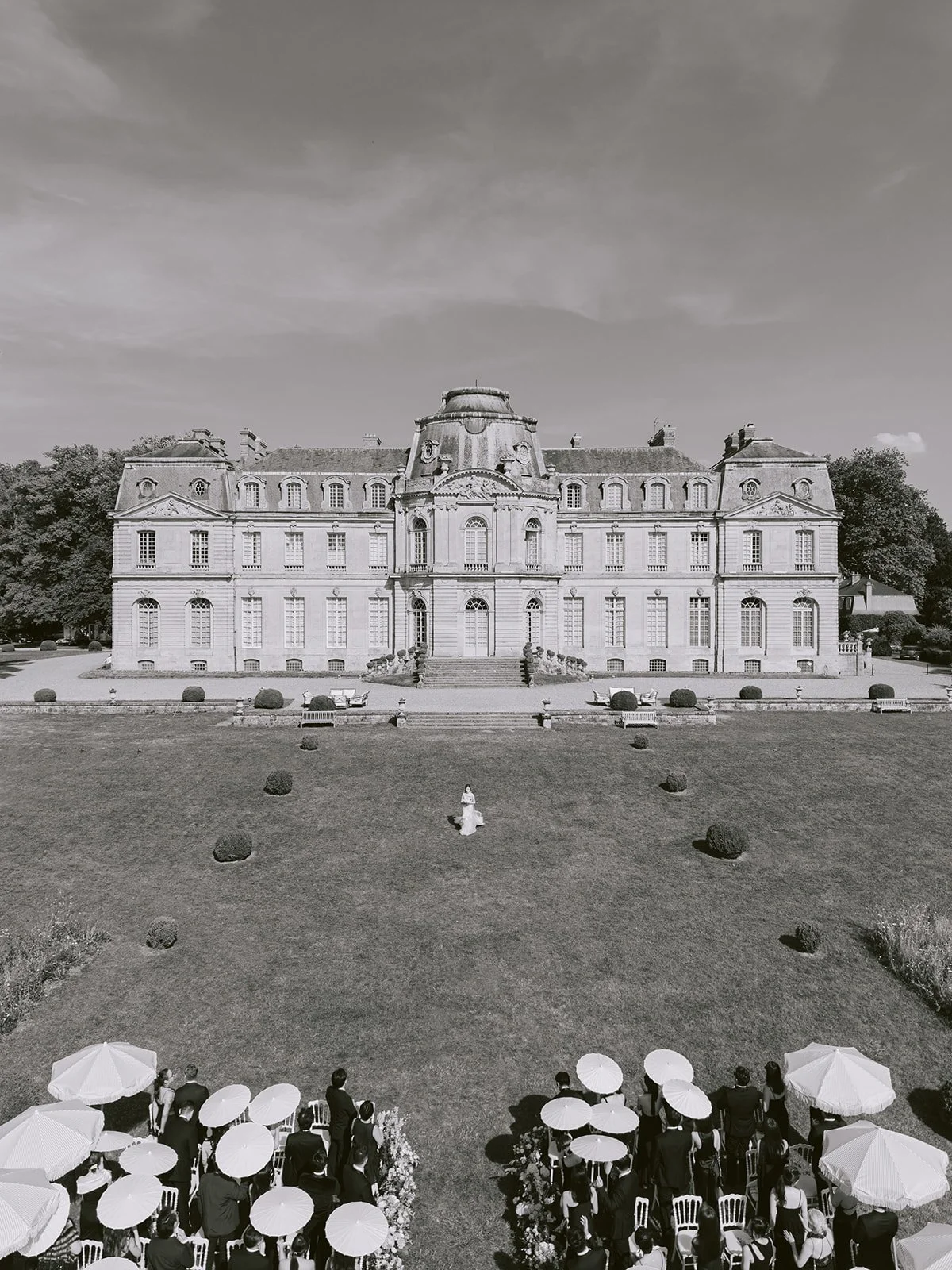 Wedding guests gathered outside a French château near Paris