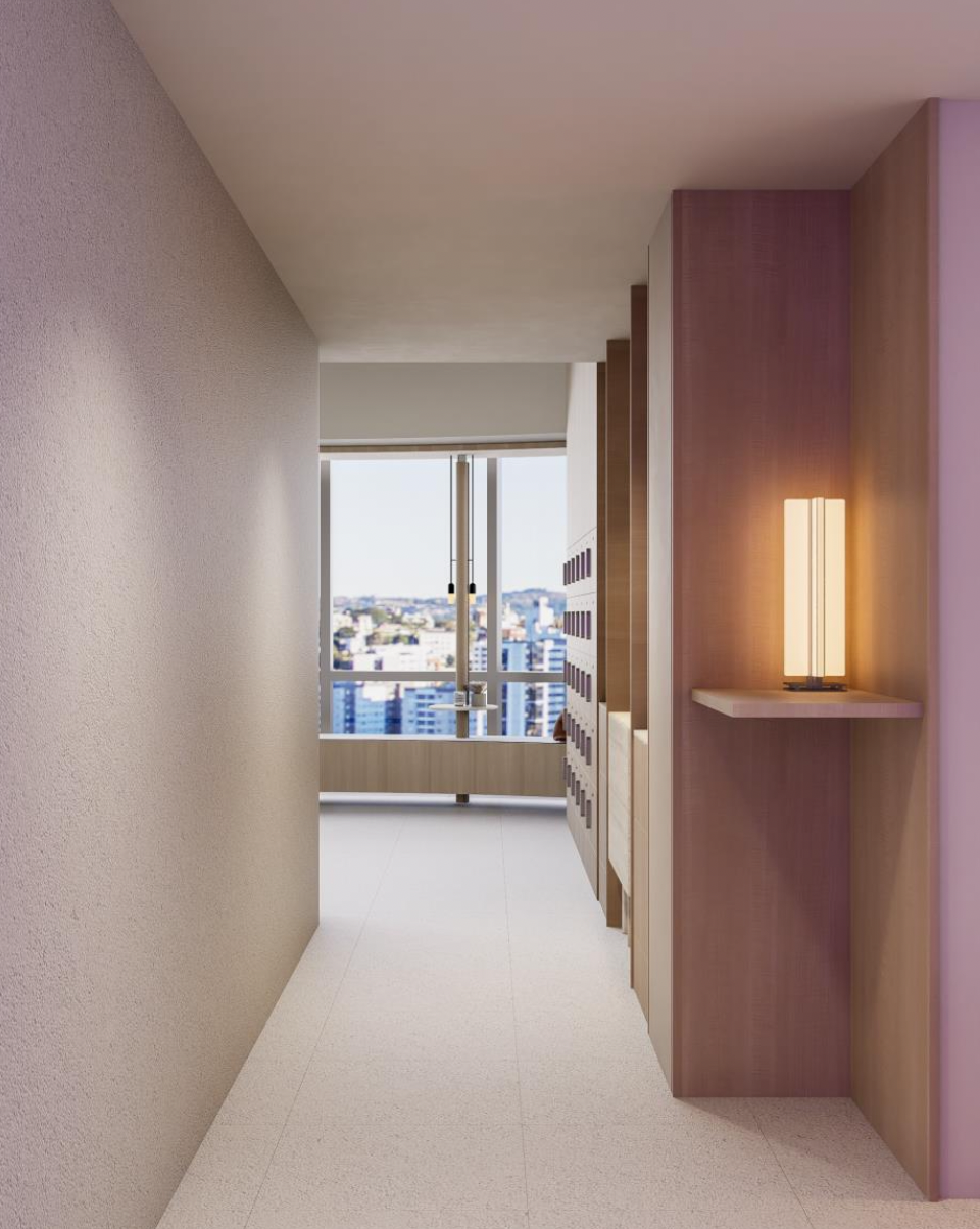 Modern hallway with beige carpet, textured wall on the left, and wooden and purple decor elements on the right, leading to a bright room with large windows and a city view.