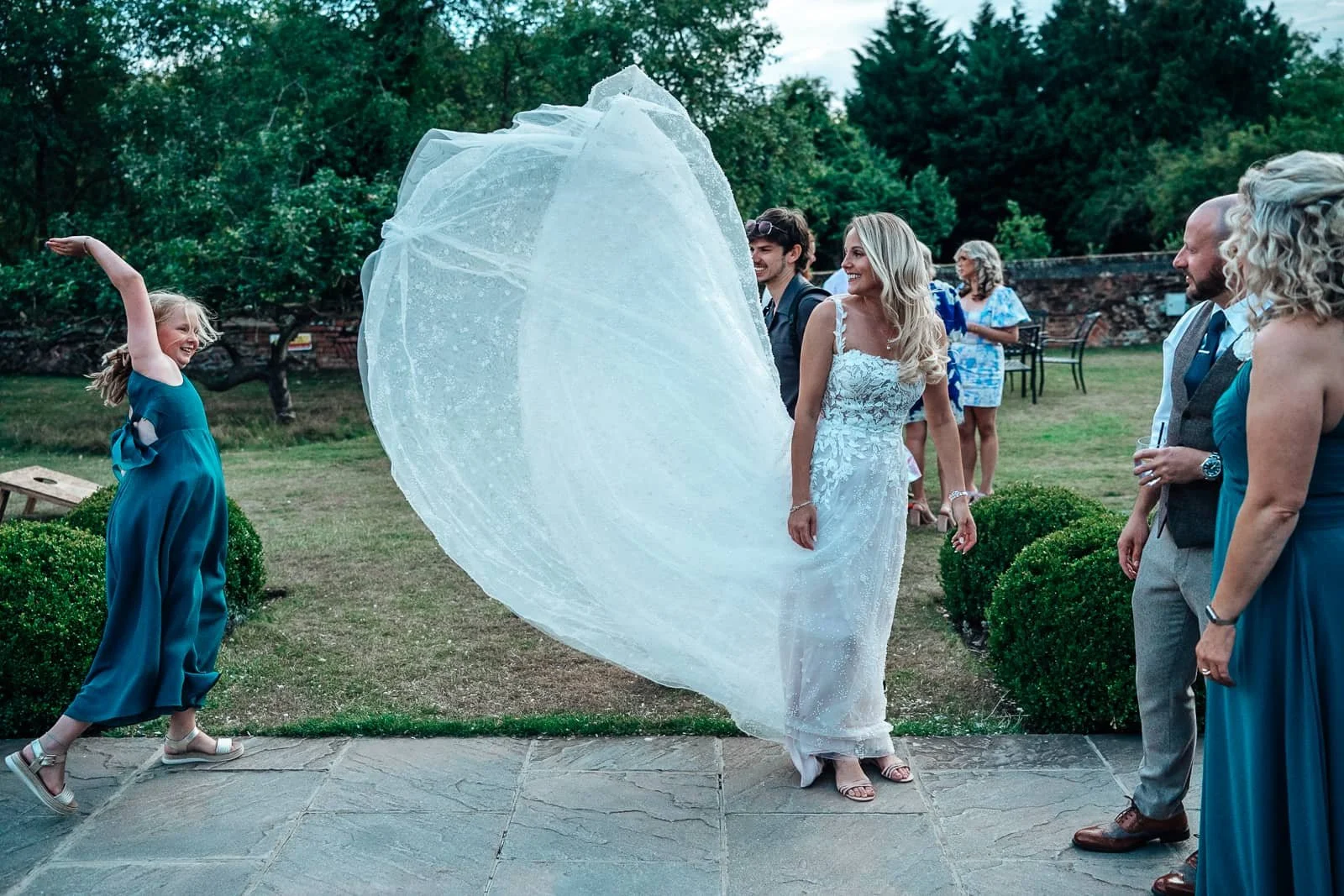 Brides wedding dress in the wind at Ufton Court Wedding venue
