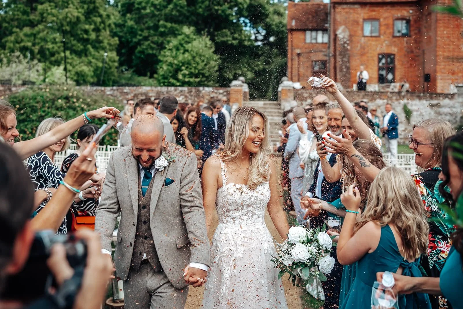 Confetti thrown at couple at Ufton Court Wedding Ceremony