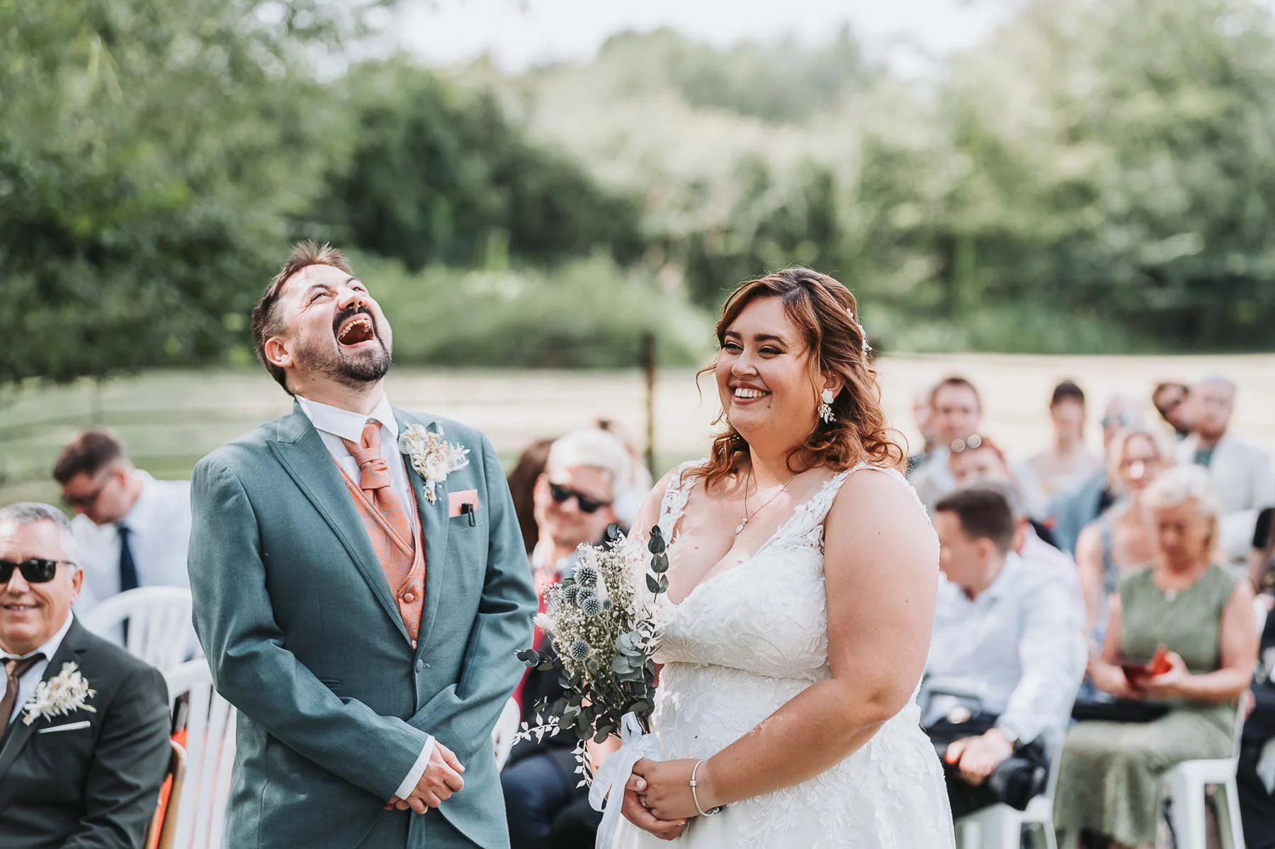 groom laughing during wedding ceremony ISIS farmhouse oxford