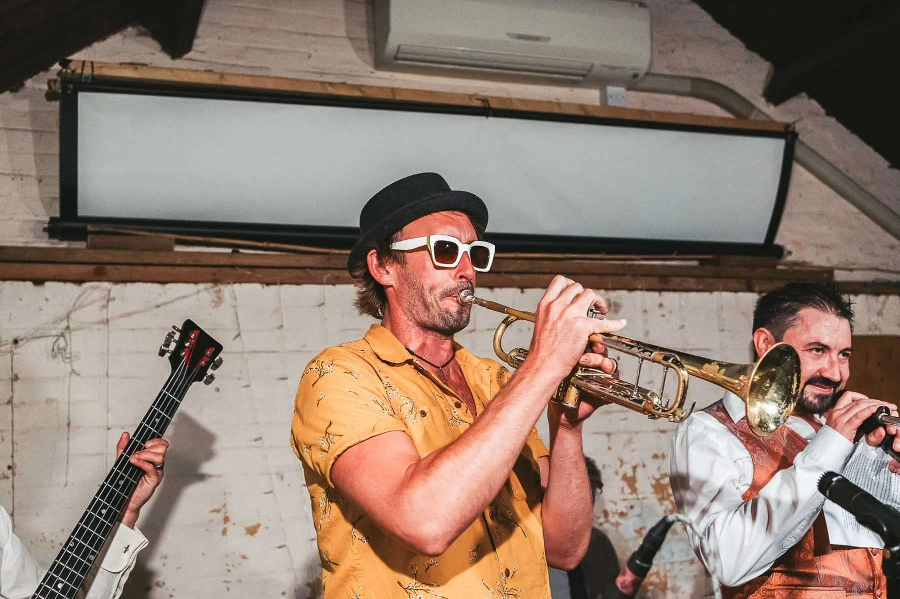Wedding guest playing the Trumpet during wedding reception