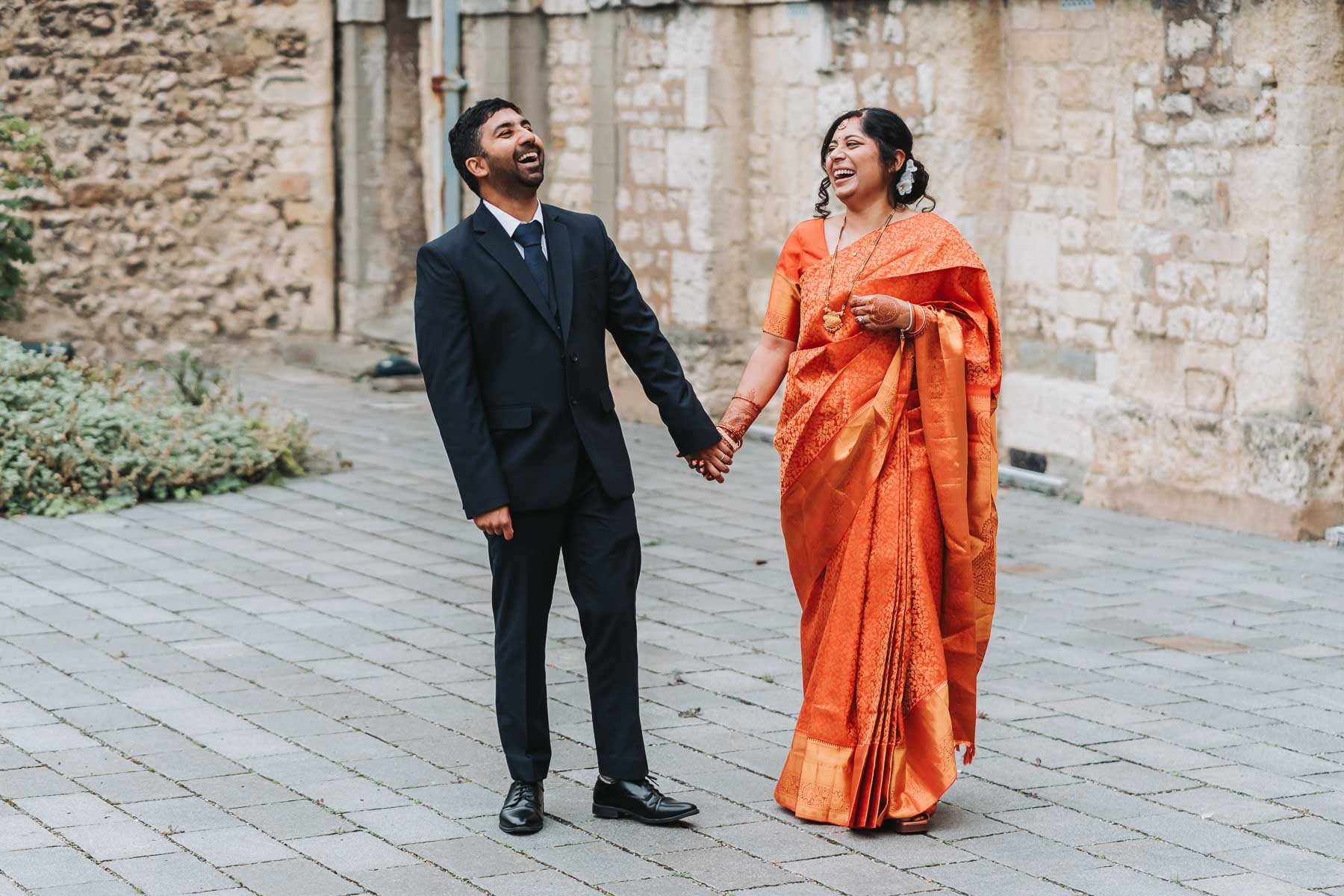 bride-and-groom-walking-through-oxford-city-centre.jpg
