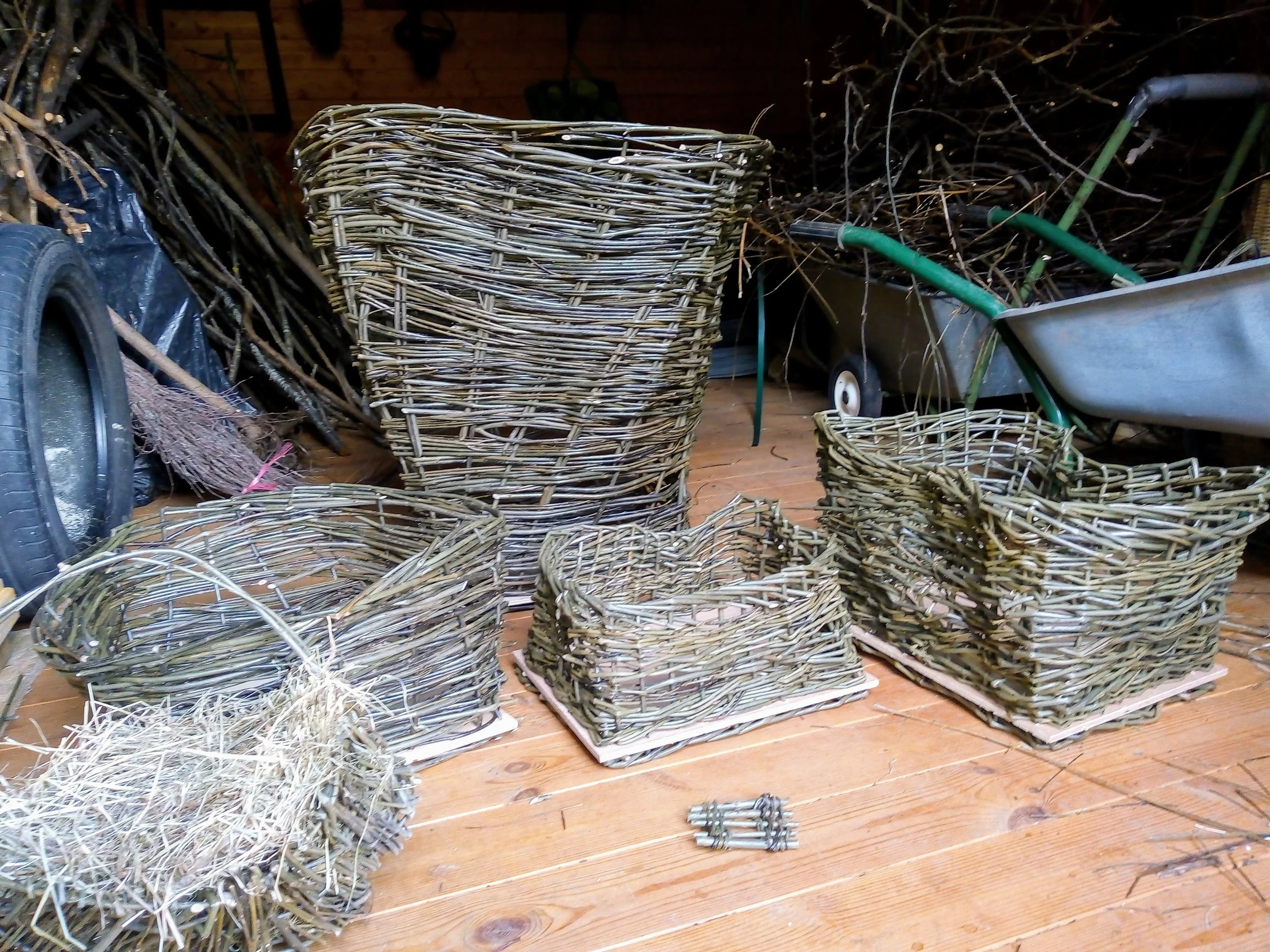 Various empty woven wicker baskets and log baskets of different sizes created by awaywithwillow.com