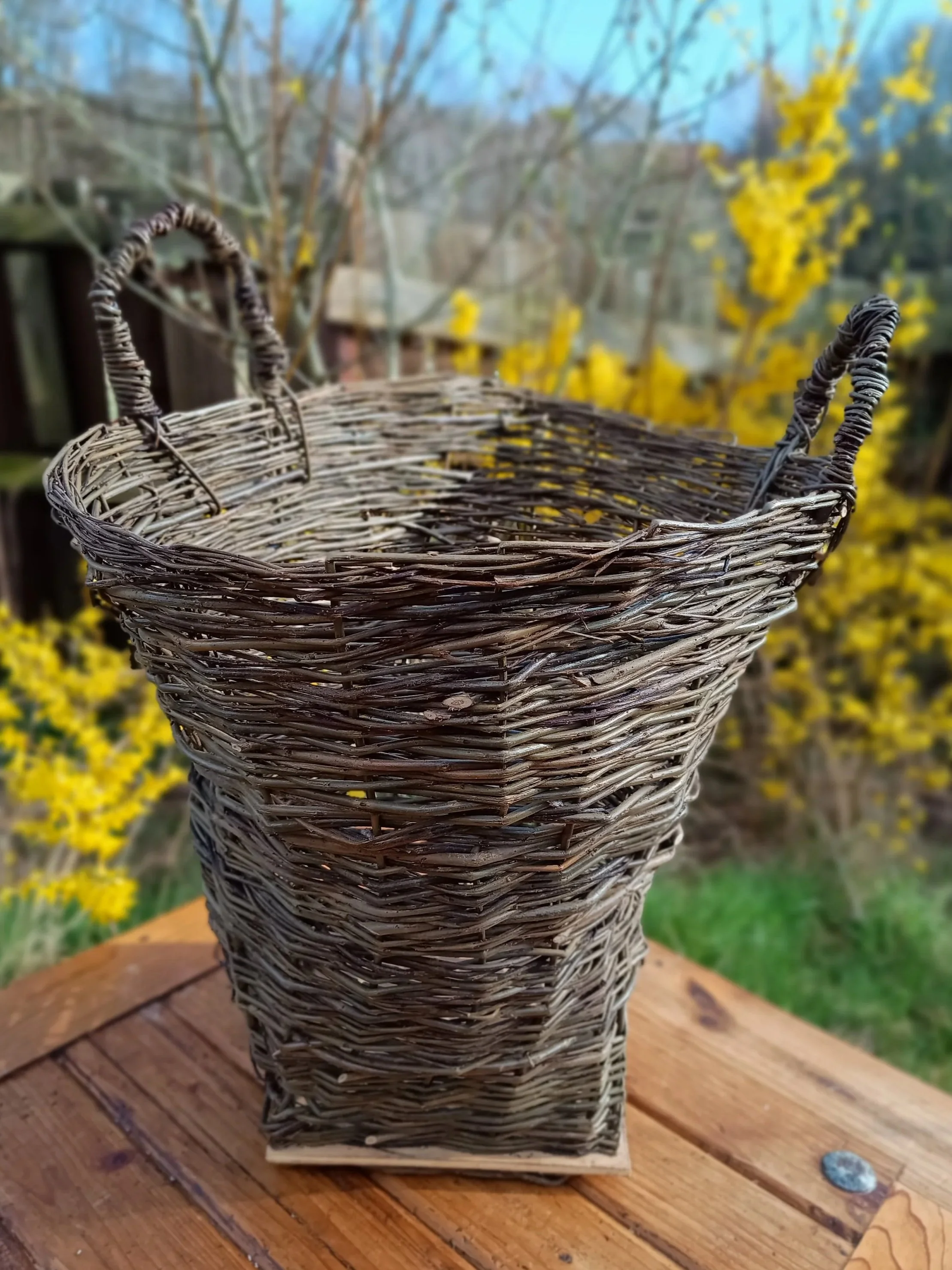 Item 14 Extra large log basket with handles and a wooden base £65