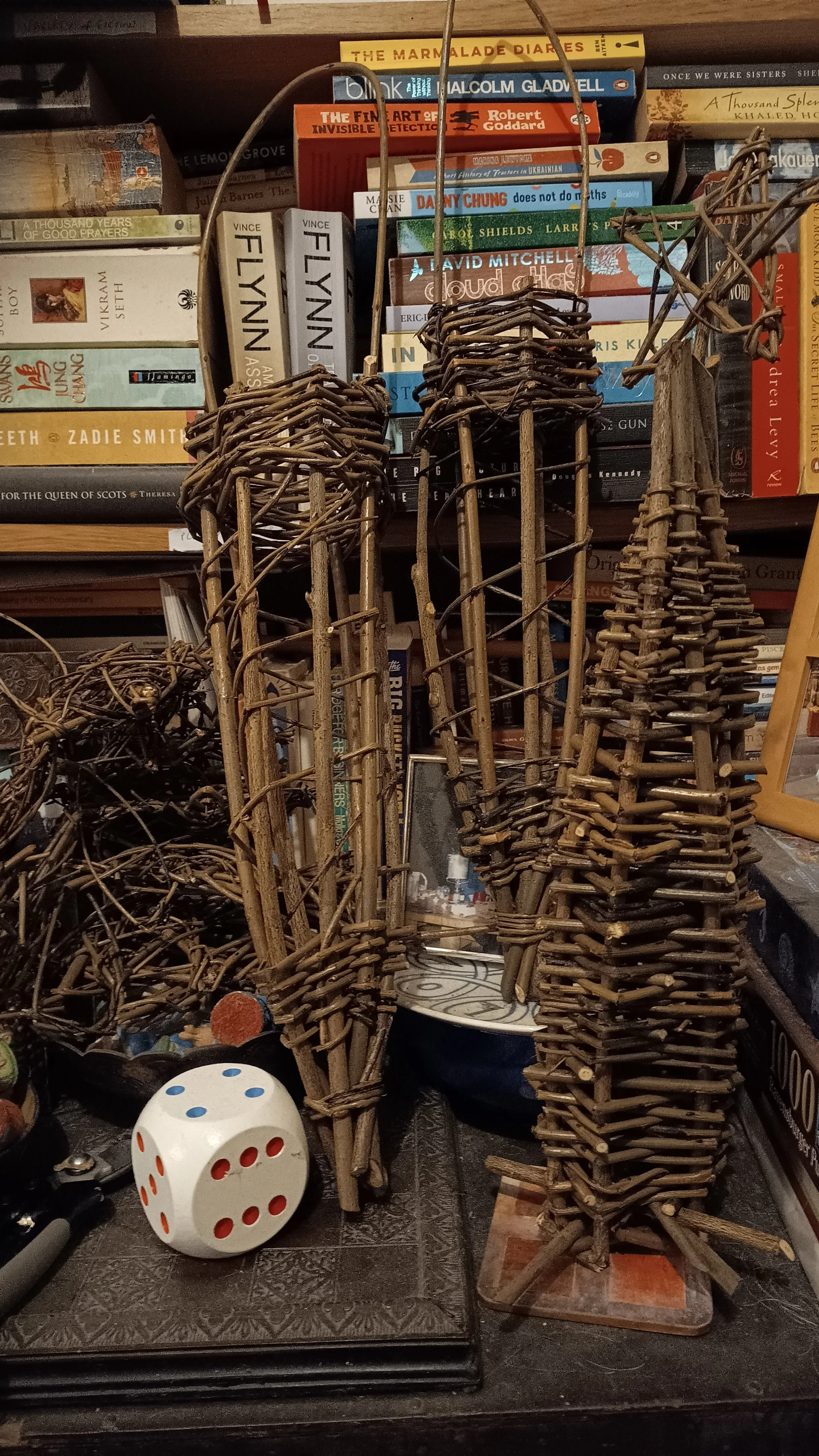 Various woven willow bird feeders and woven willow tree Xmas decorations created by awaywithwillow.com