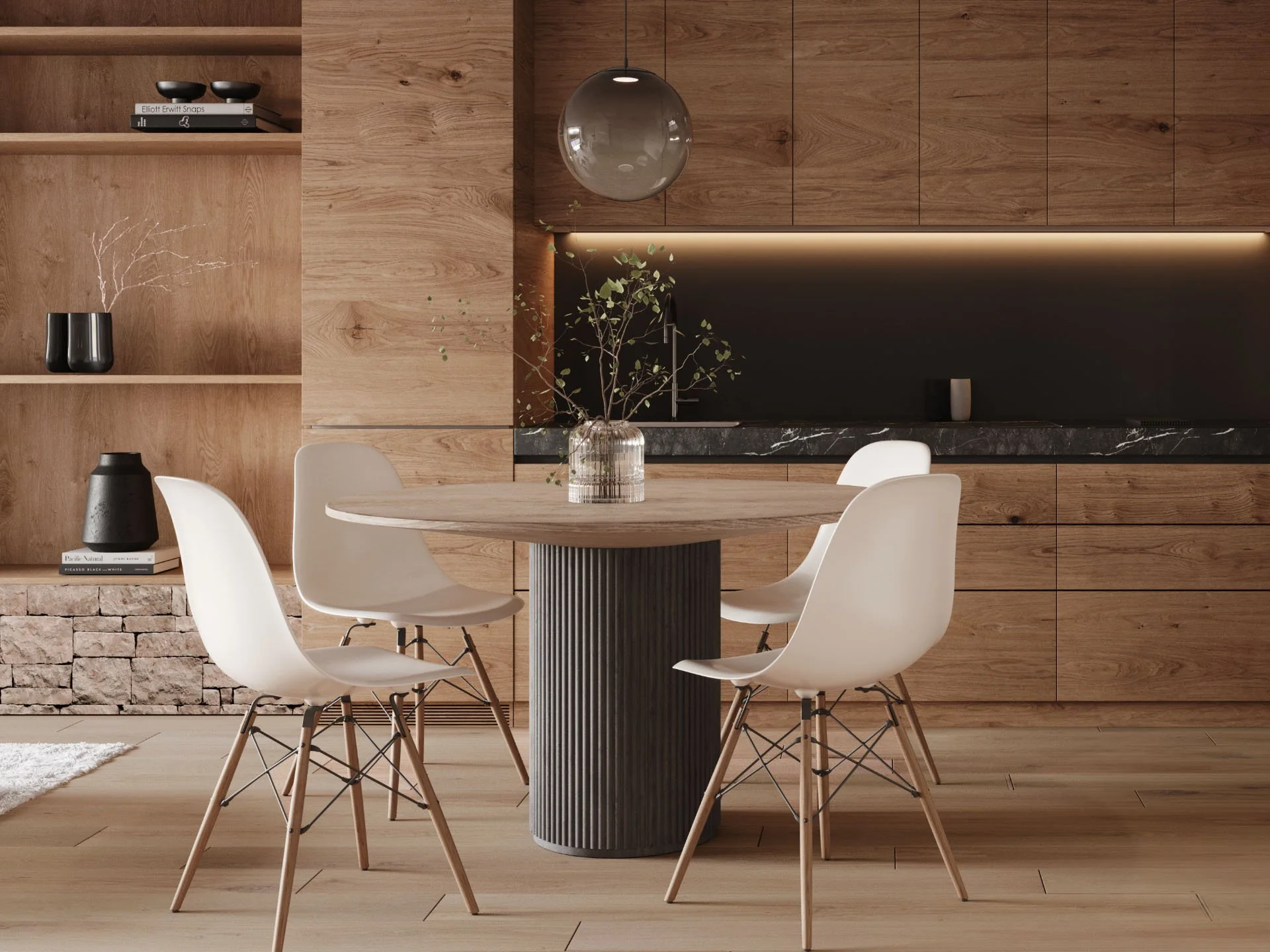 Dettaglio degli interni raffinati presso la Residenza Brocco: una cucina con area pranzo che reinterpreta il comfort alpino attraverso materiali naturali e arredi contemporanei a San Bernardino.