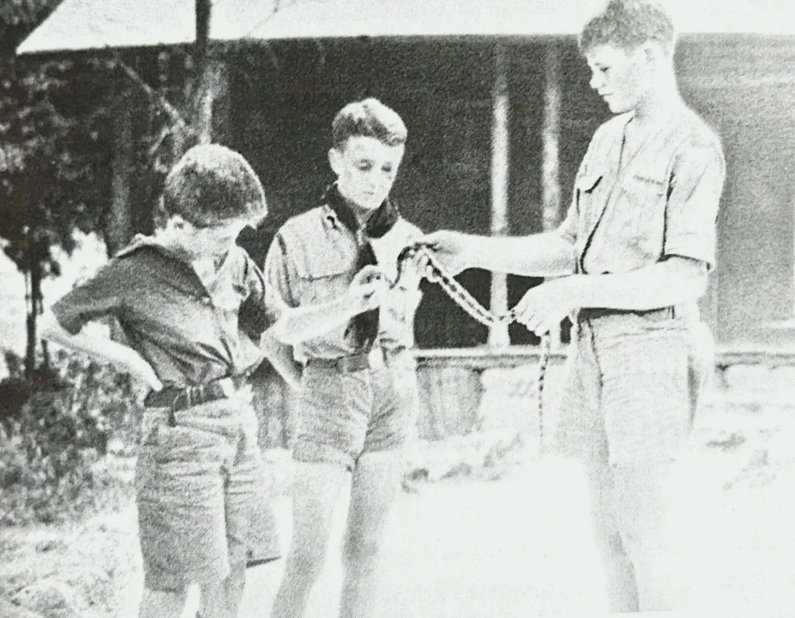 Scouts holding a snake at the Nature Museum