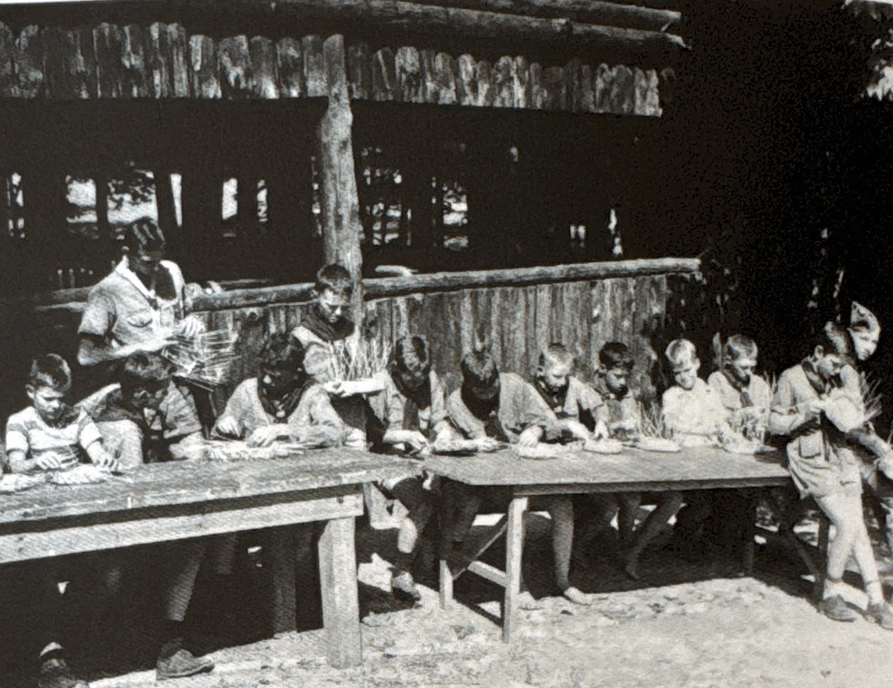 Scouts working on earning their basketry merit badge at the Craft Lodge