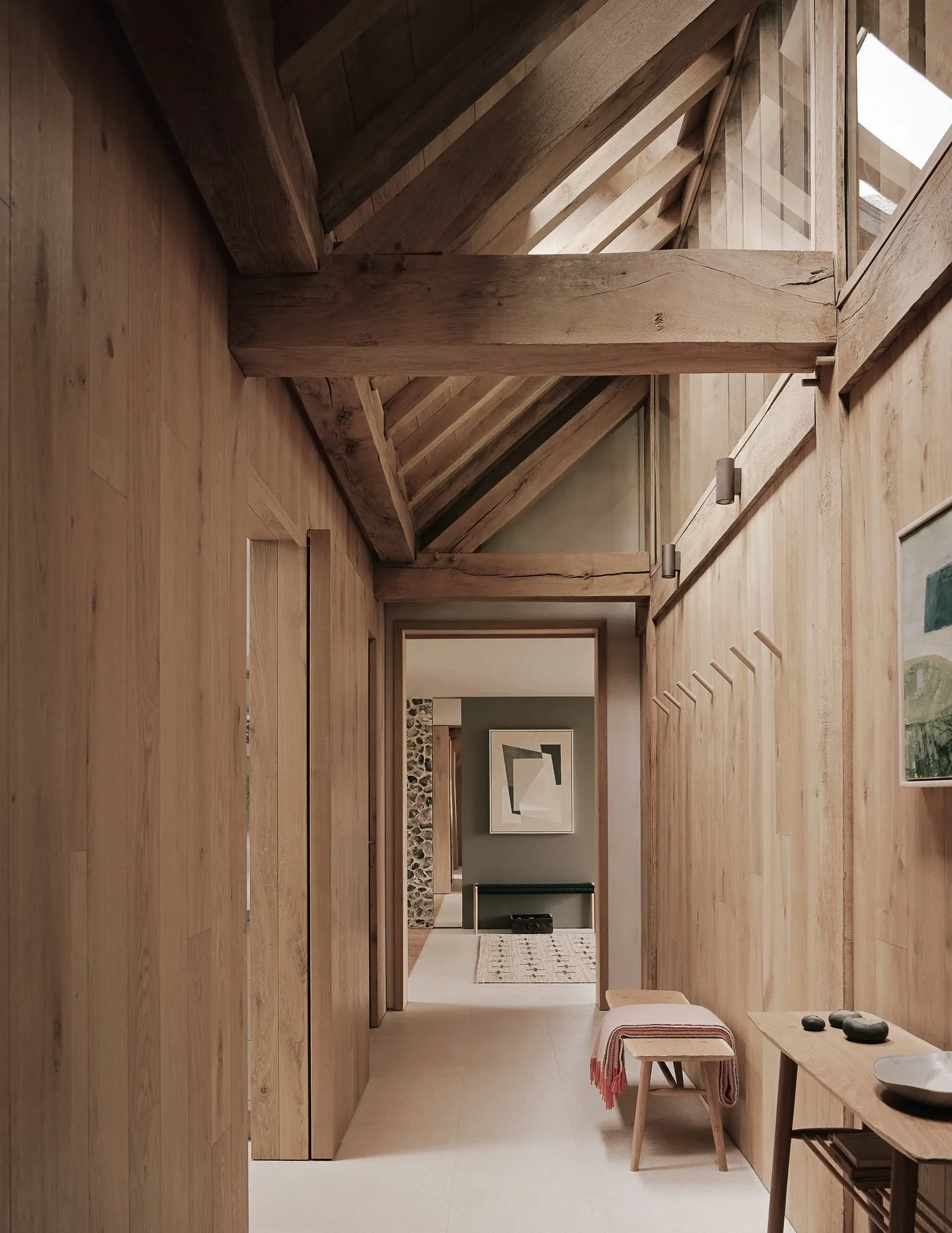 A Mawnan Bench and Console Table looking very at home in a quiet and spectacular corner of Surrey.

Architects McLean Quinlan were challenged with designing a modern, sustainable house with character and elegance, sympathetic to its surroundings yet 