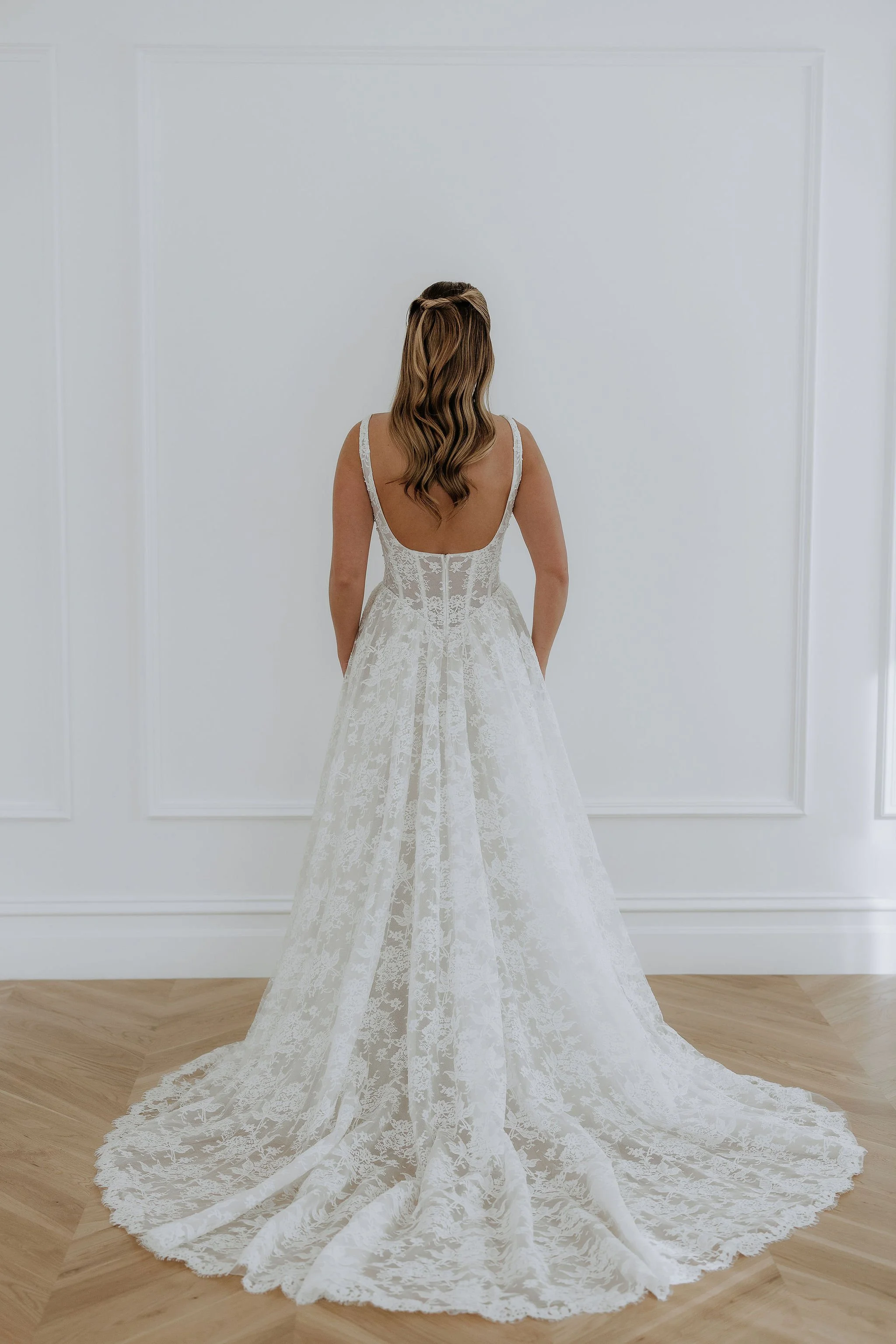 Back View of Kelly Lin's Elle Dress. Full lace statement train for the modern bride.