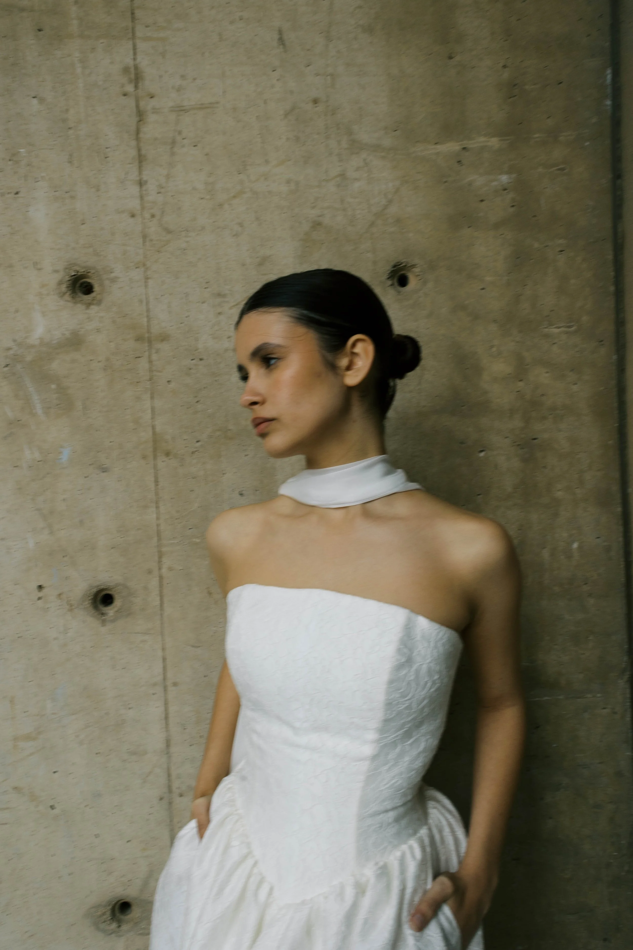 Titania Dress by Rolling in Roses – contemporary bridal gown inspired by Shakespeare's era, featuring a dropped waistline, sculptural tulip-shaped skirt with hidden pockets, and traditional corsetry techniques using high-quality sprung boning, crafte