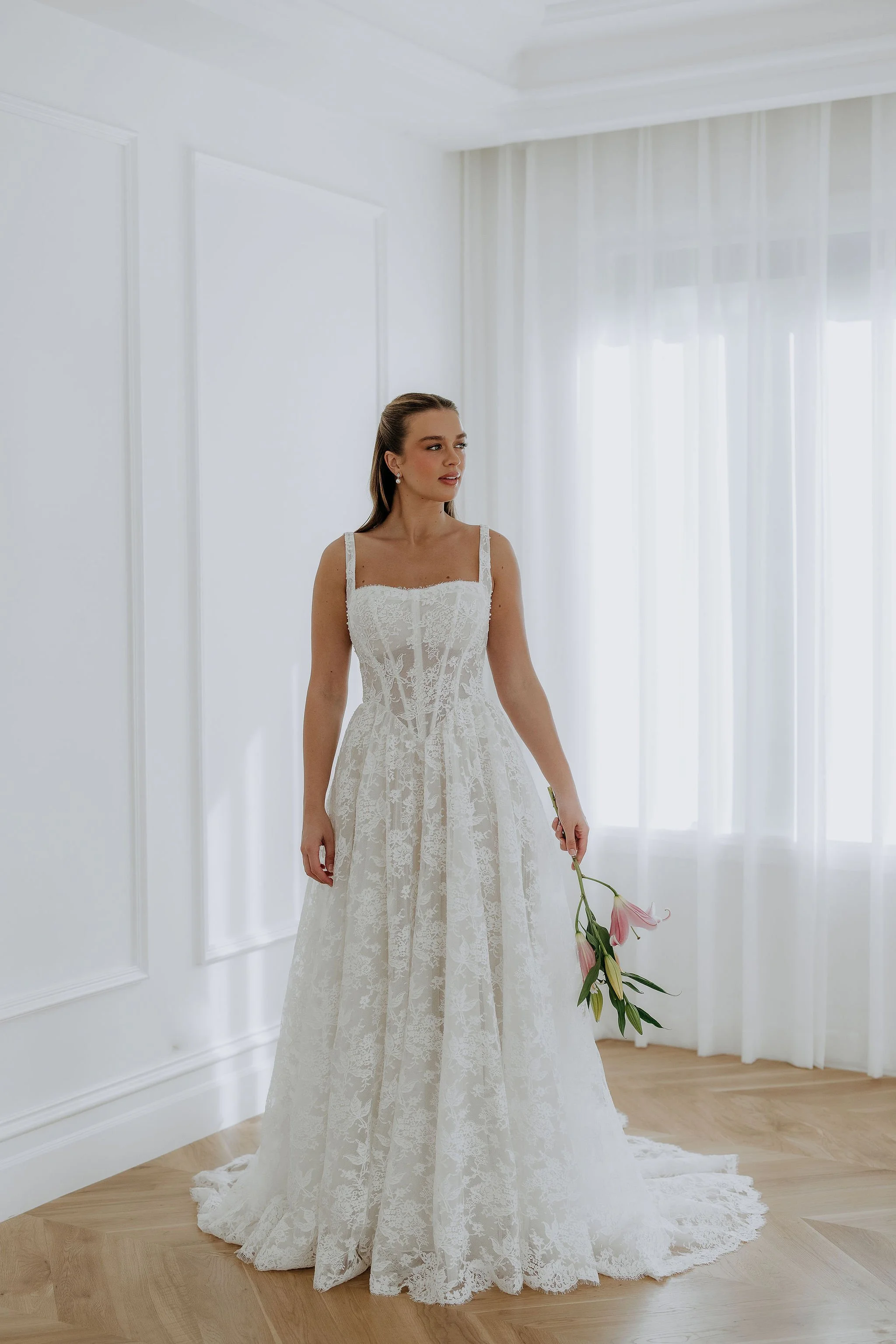 Elle By Kelly Lin, elegant full lace dress with full a line skirt. Try in our Salisbury wedding dress studio.