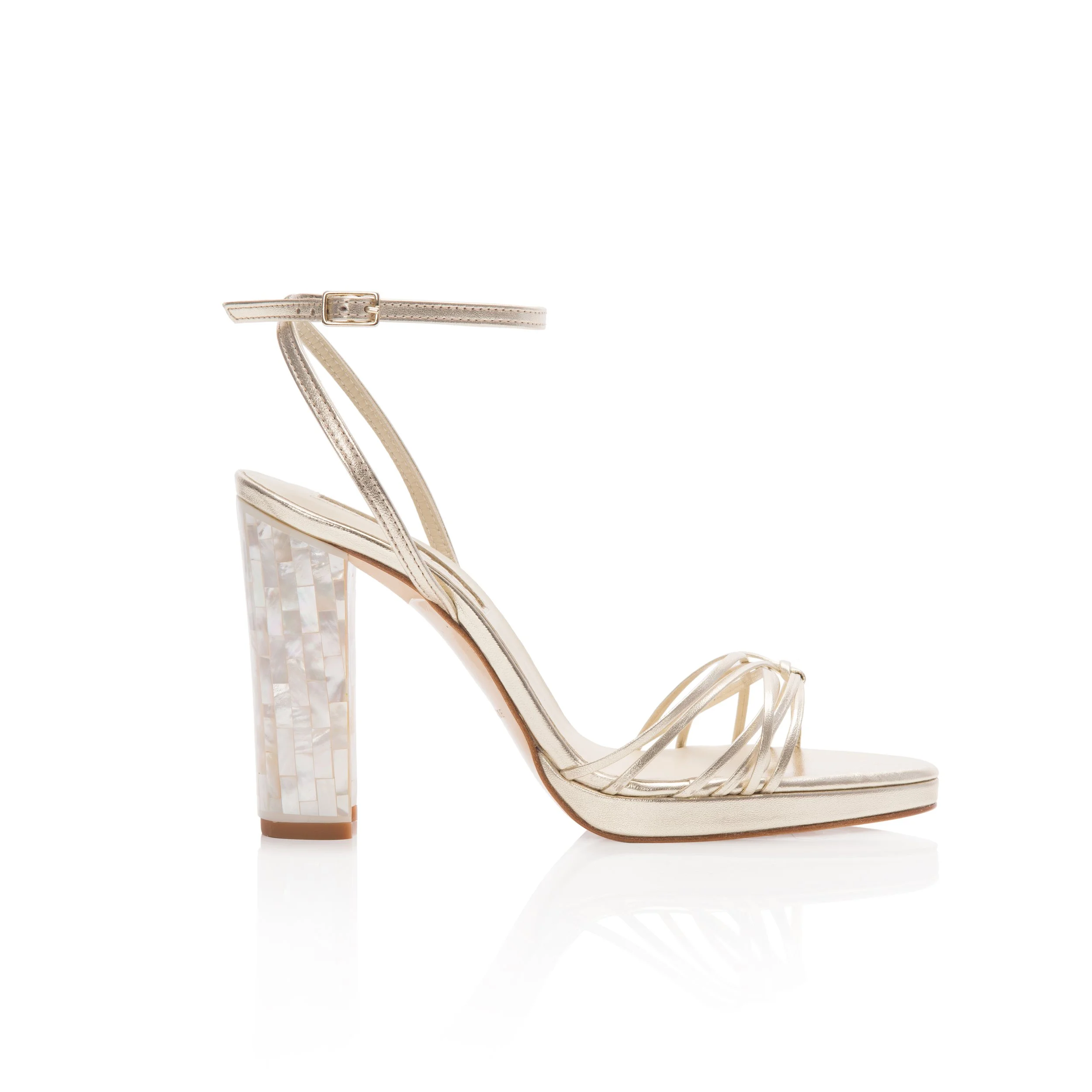 Strappy beige high-heeled sandal with a block heel covered in iridescent shell-like material, open toe, ankle strap, and thin straps across the toes.  Wedding Shoes to die for. Modern wedding shoes. Cool wedding shoes.