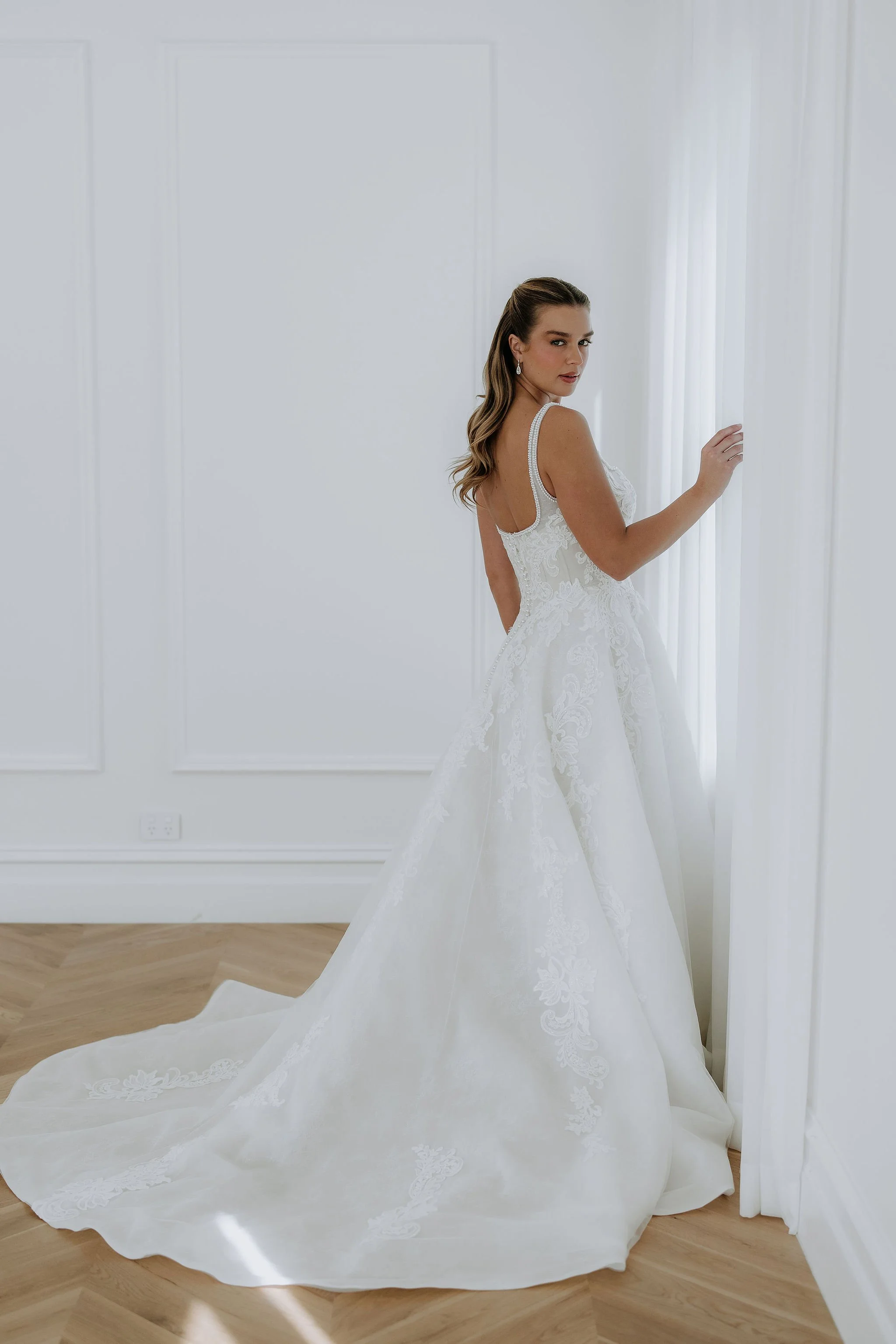 Full train of Ornella, an elegant wedding dress by Kelly Lin. Light, modern and full of character. A dress no one will forget! Try at our Salisbury wedding dress shop.