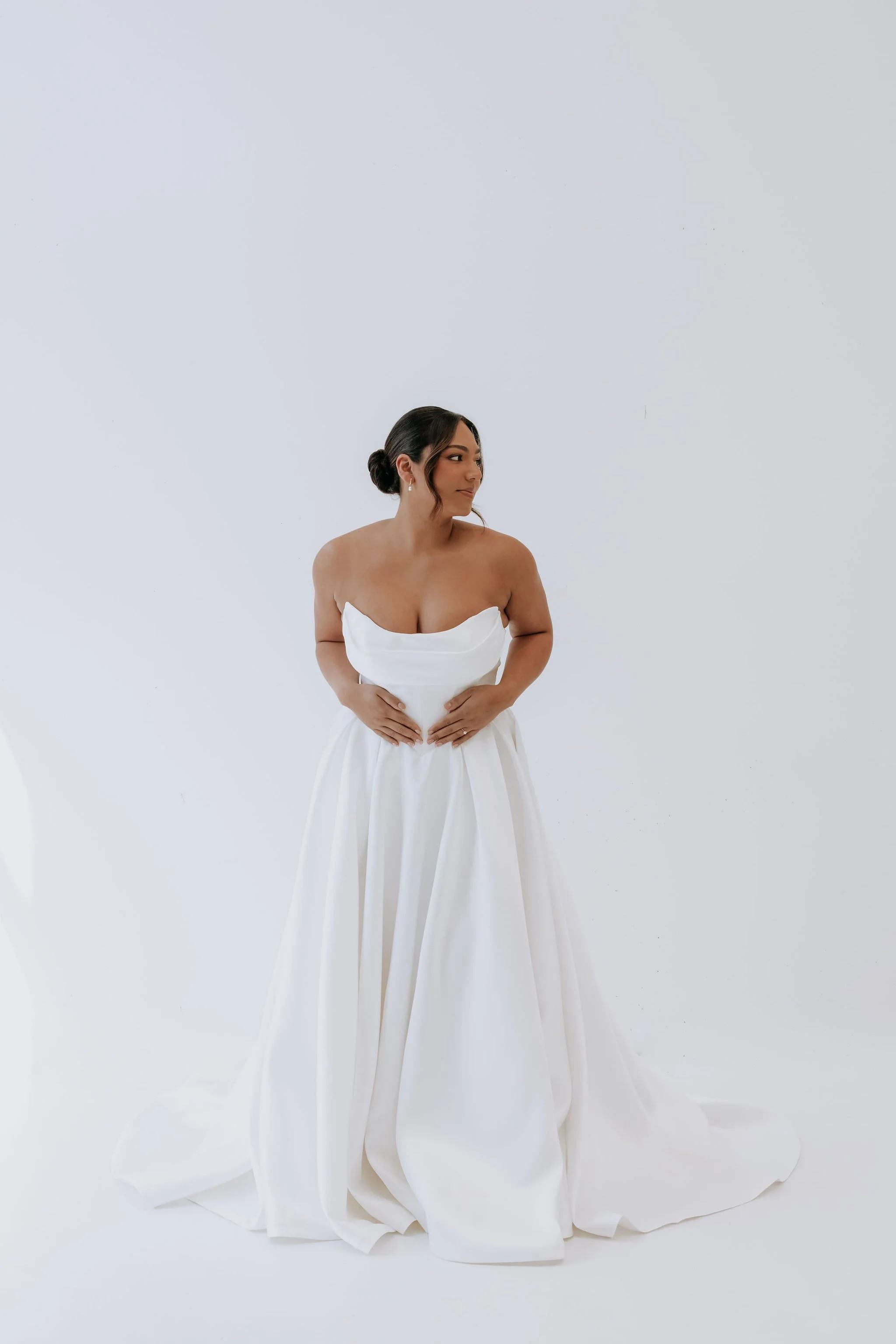 Abbey by Kelly Lin is a strapless Mikado dress with a Basque waist. Available to try at our Salisbury Boutique.