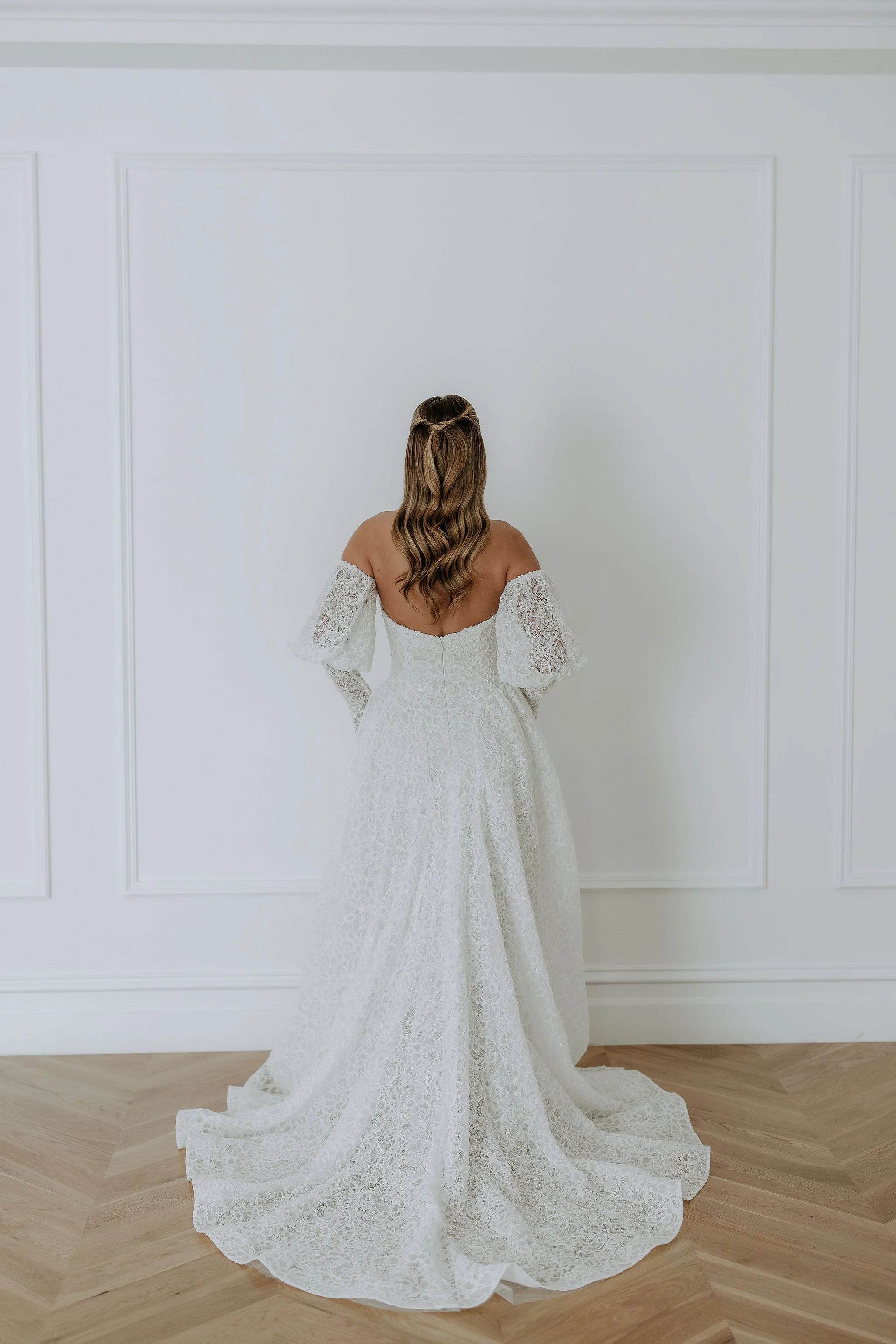 Back view of Lottie by Kelly Lin. Fully boned bodice to snatch in the waist. Modern vintage wedding dress.