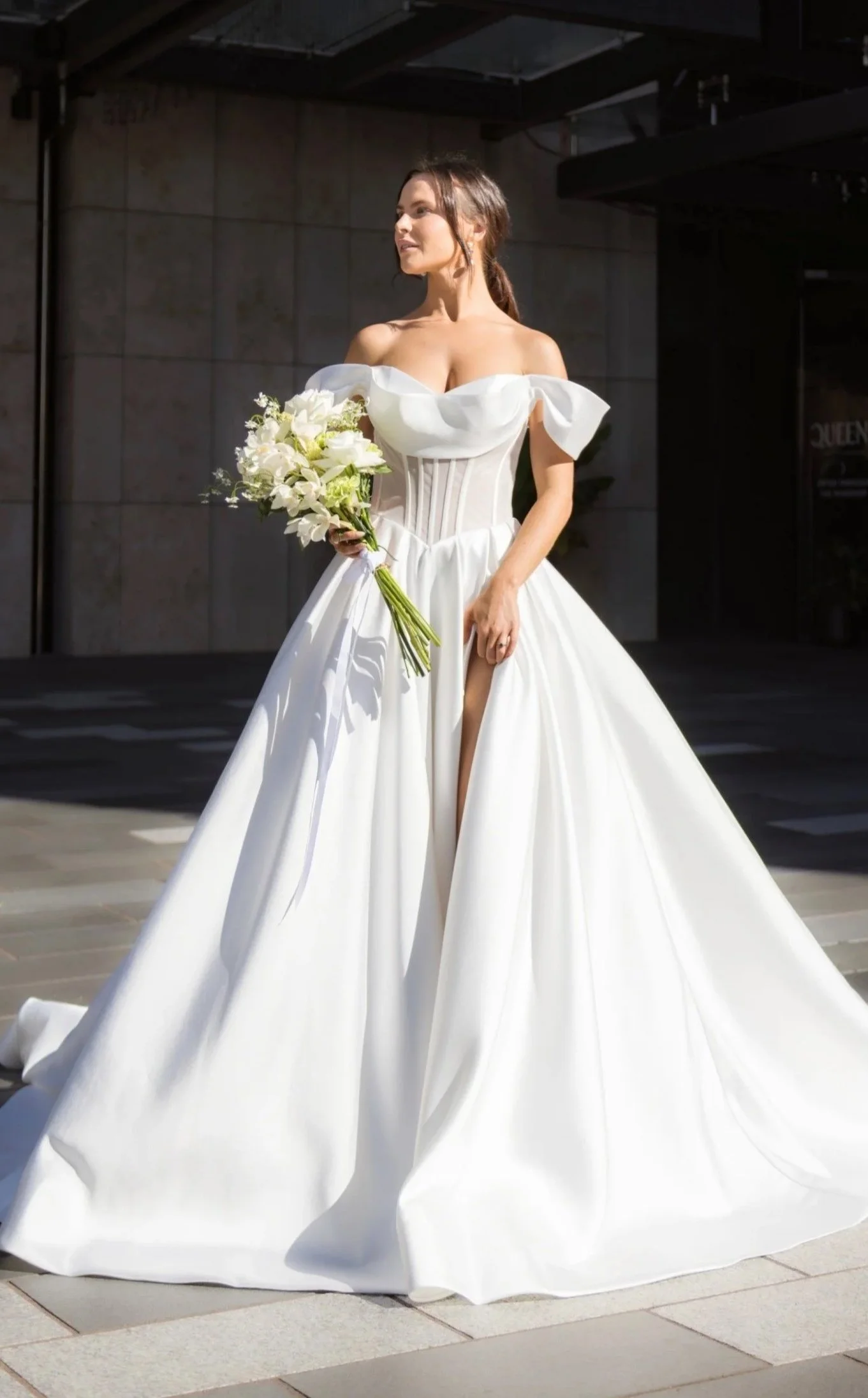 Modern sample sale wedding dress with full skirt and corset bodice