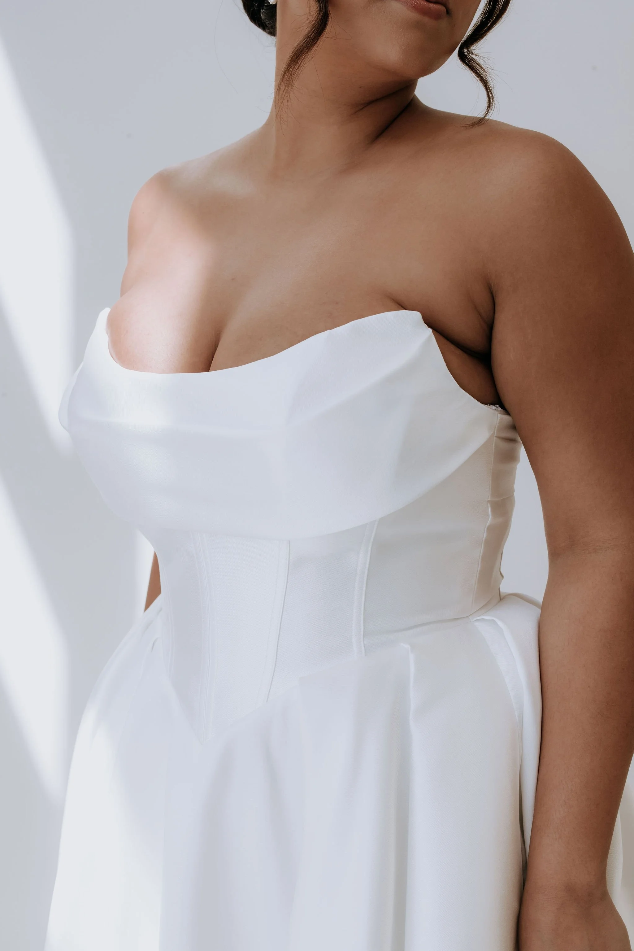 Abbey Dress form Australian designer Kelly Lin is a modern Mikado Dress featuring a basque waist. Available to try at our Salisbury Dress Shop.