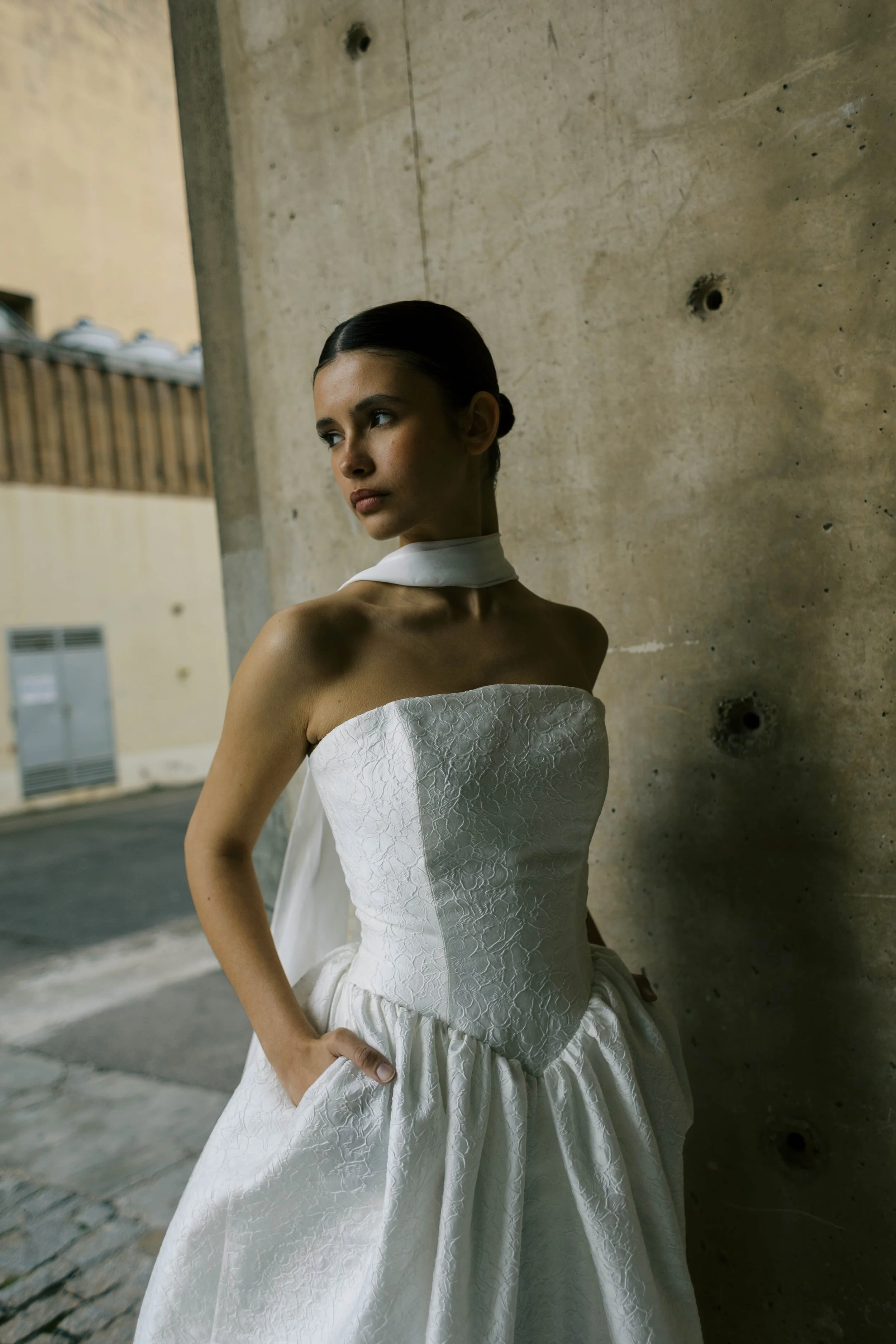 Titania Dress by Rolling in Roses – contemporary bridal gown inspired by Shakespeare's era, featuring a dropped waistline, sculptural tulip-shaped skirt with hidden pockets, and traditional corsetry techniques using high-quality sprung boning, crafte