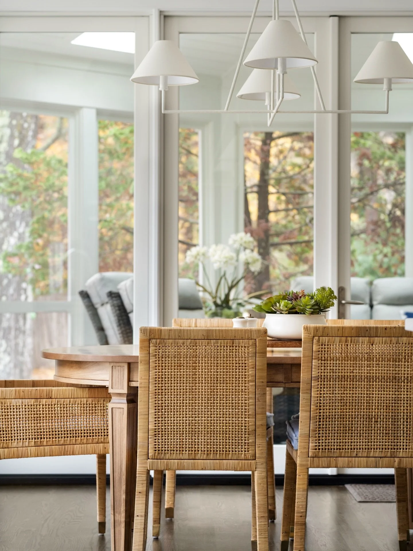 Small material changes can completely shift the feeling of a room. Replacing tile with warm hardwood and introducing woven dining chairs brought a softer, more relaxed character to this dining room. 🤍

Design: @colorandcrownid 
Builder: @revivalcraf