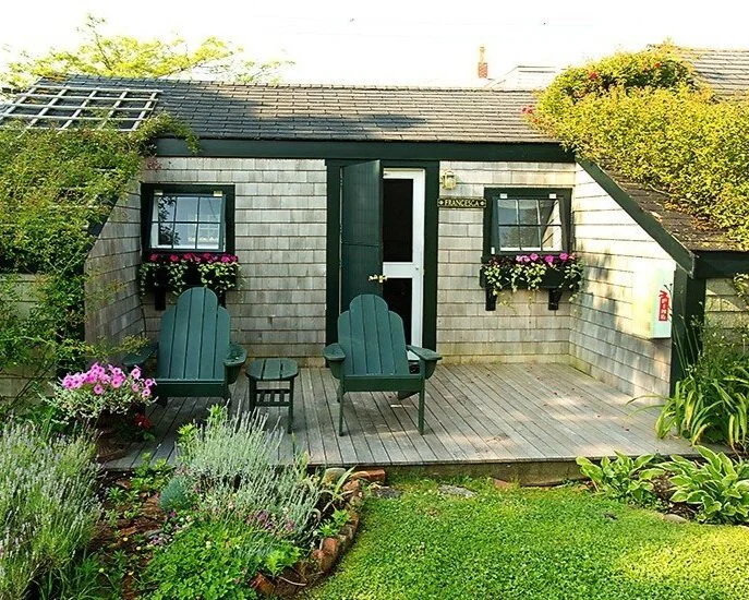 A small house in a garden or outdoor space designed for relaxation and leisure