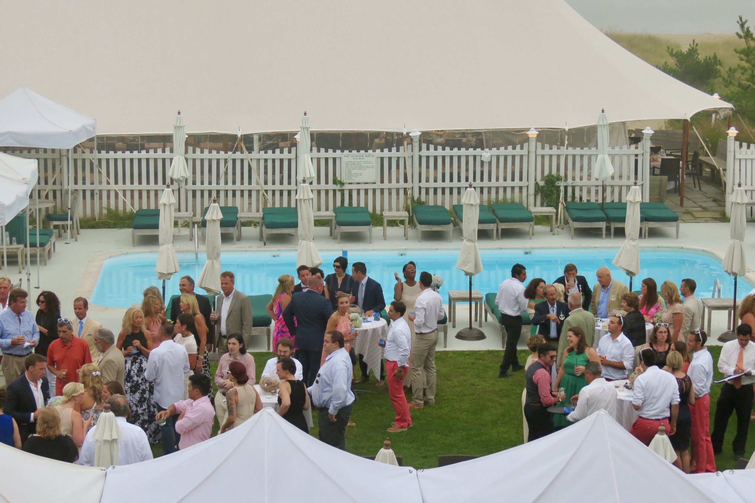 A wedding reception or a party taking place beside pool