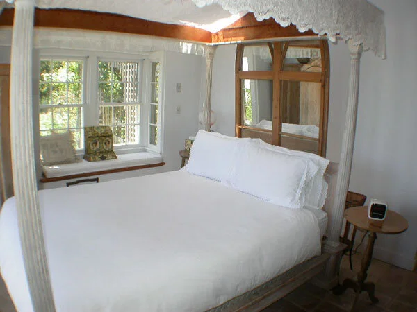 A bedroom in a cottage at The Summer House