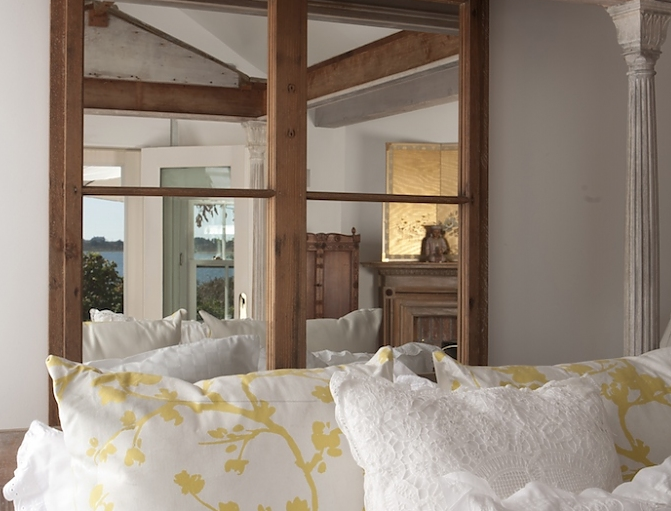 A portion of the room and a sea view outside