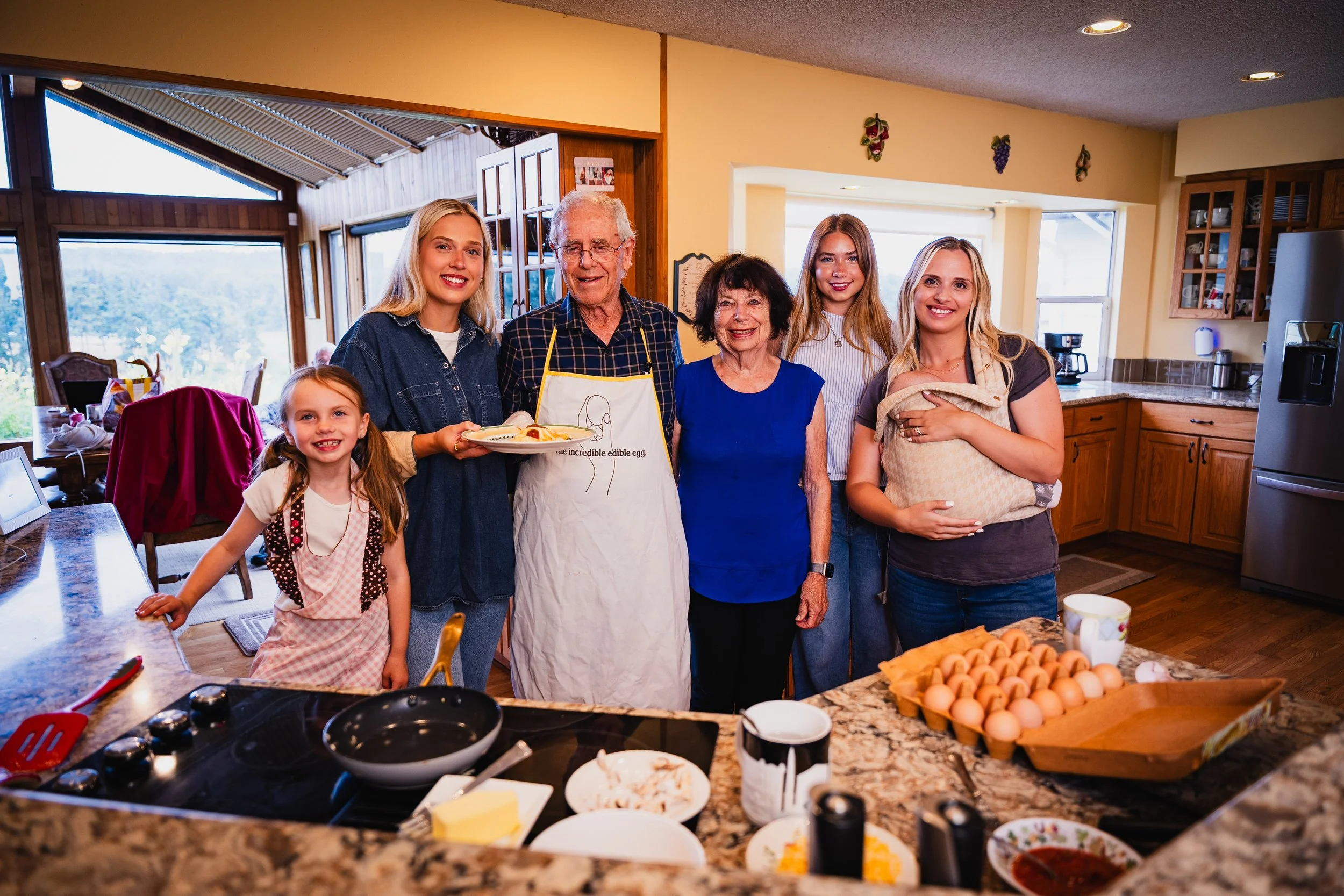 Several Wilcox family members gathered in a kitchen, reflecting the family-owned roots of Wilcox Farms.