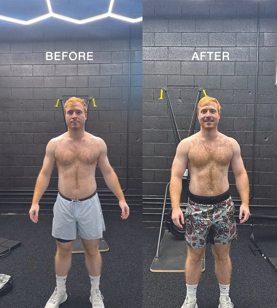 Side-by-side comparison of a shirtless man before and after a fitness transformation, standing in a gym against a black wall with lighting fixtures on the ceiling. In the before image, he wears gray shorts and white sneakers, with a neutral expression. In the after image, he wears patterned shorts and is smiling.