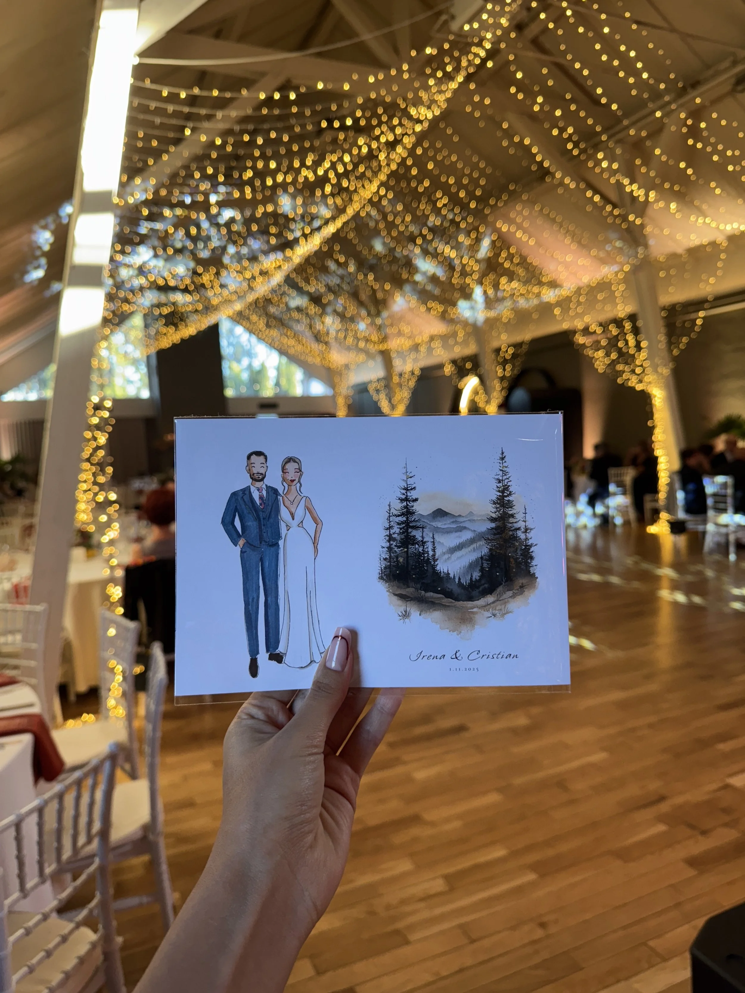 Card with illustrations of a man in a suit and a woman in a white dress, with a watercolor painting of a mountain landscape and pine trees, and the names "Irena & Cristian" with the date "1.11.2023" at the bottom.