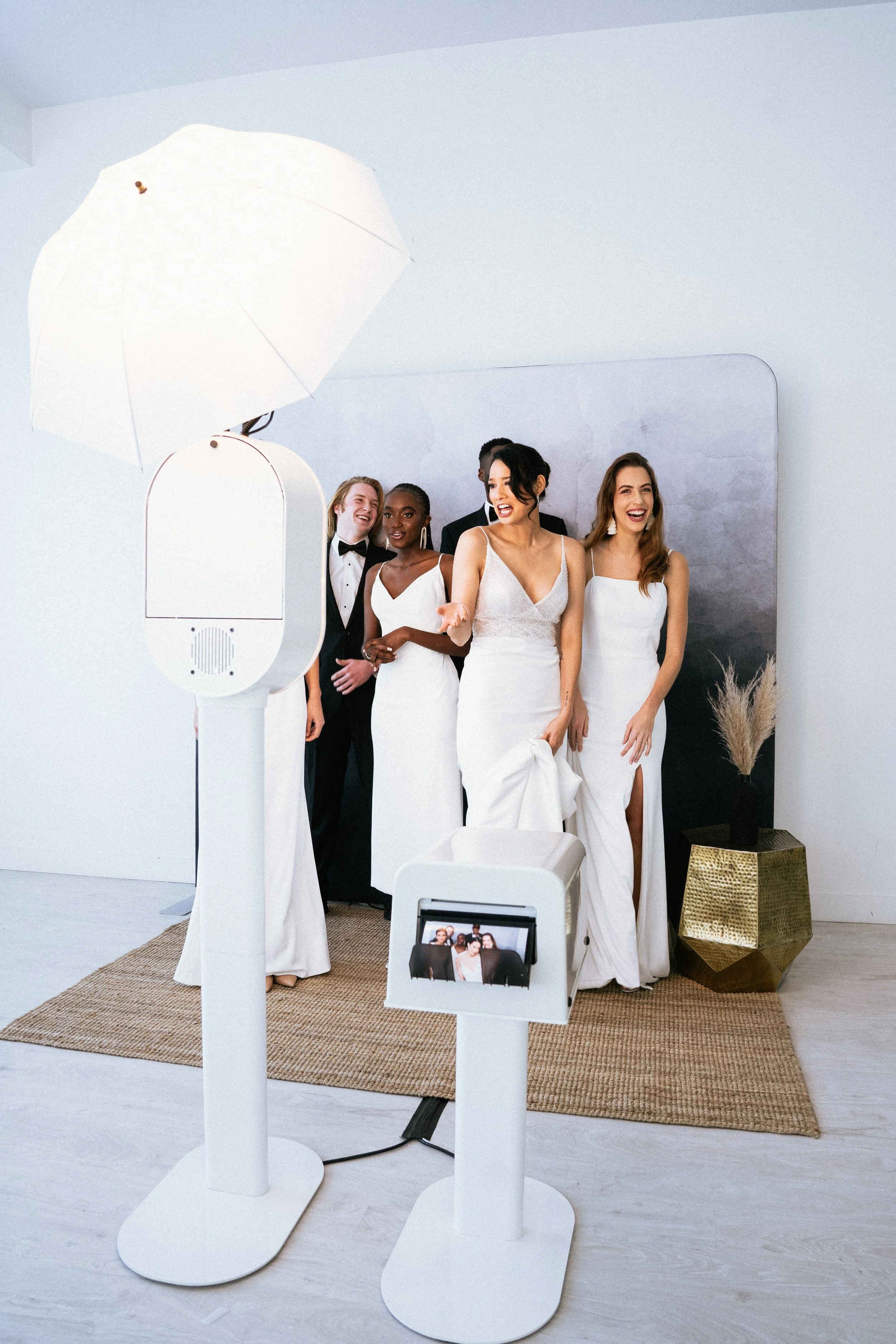 Wedding guests laughing and having fun at premium photo booth