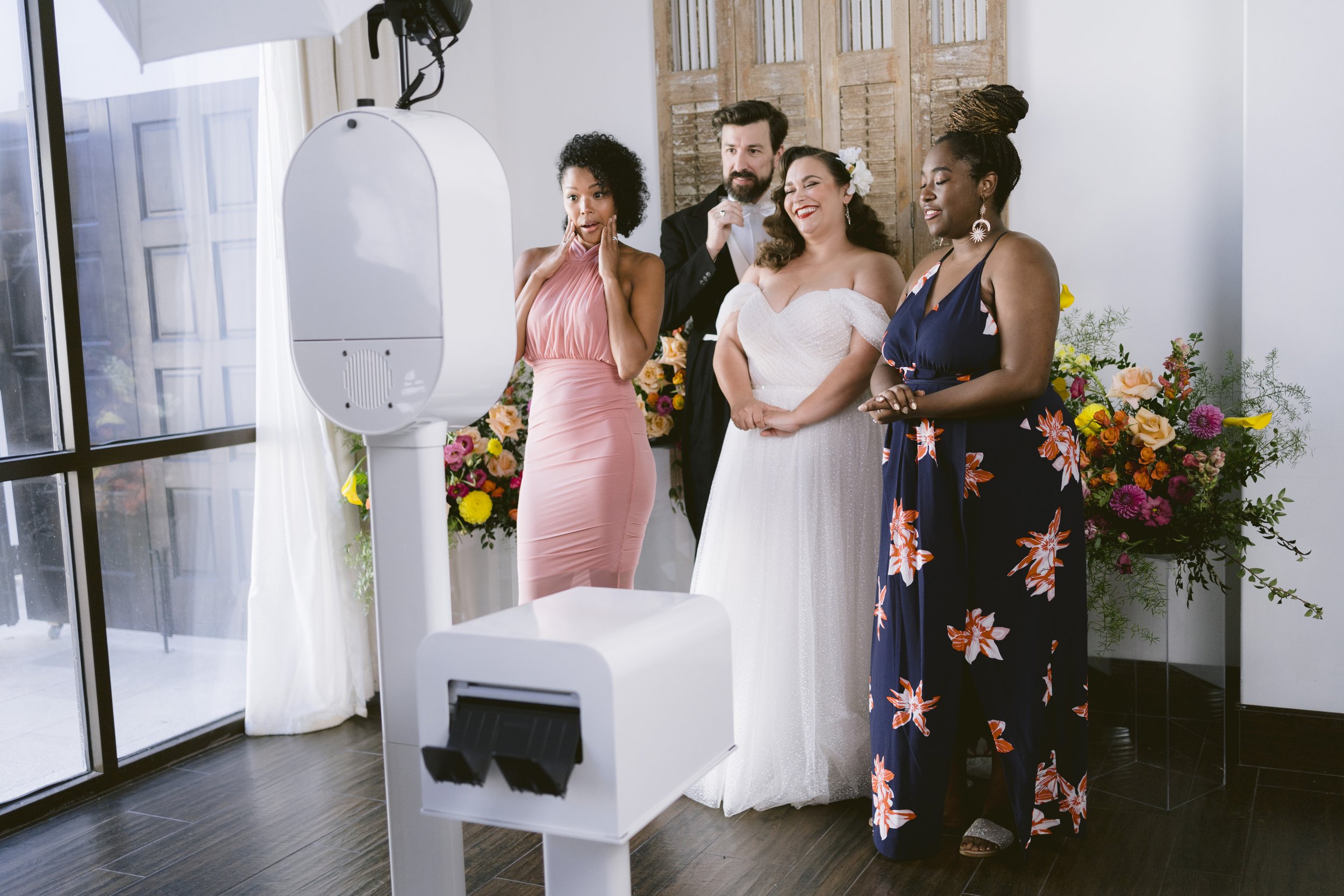 Wedding reception photo booth with elegant backdrop and custom template