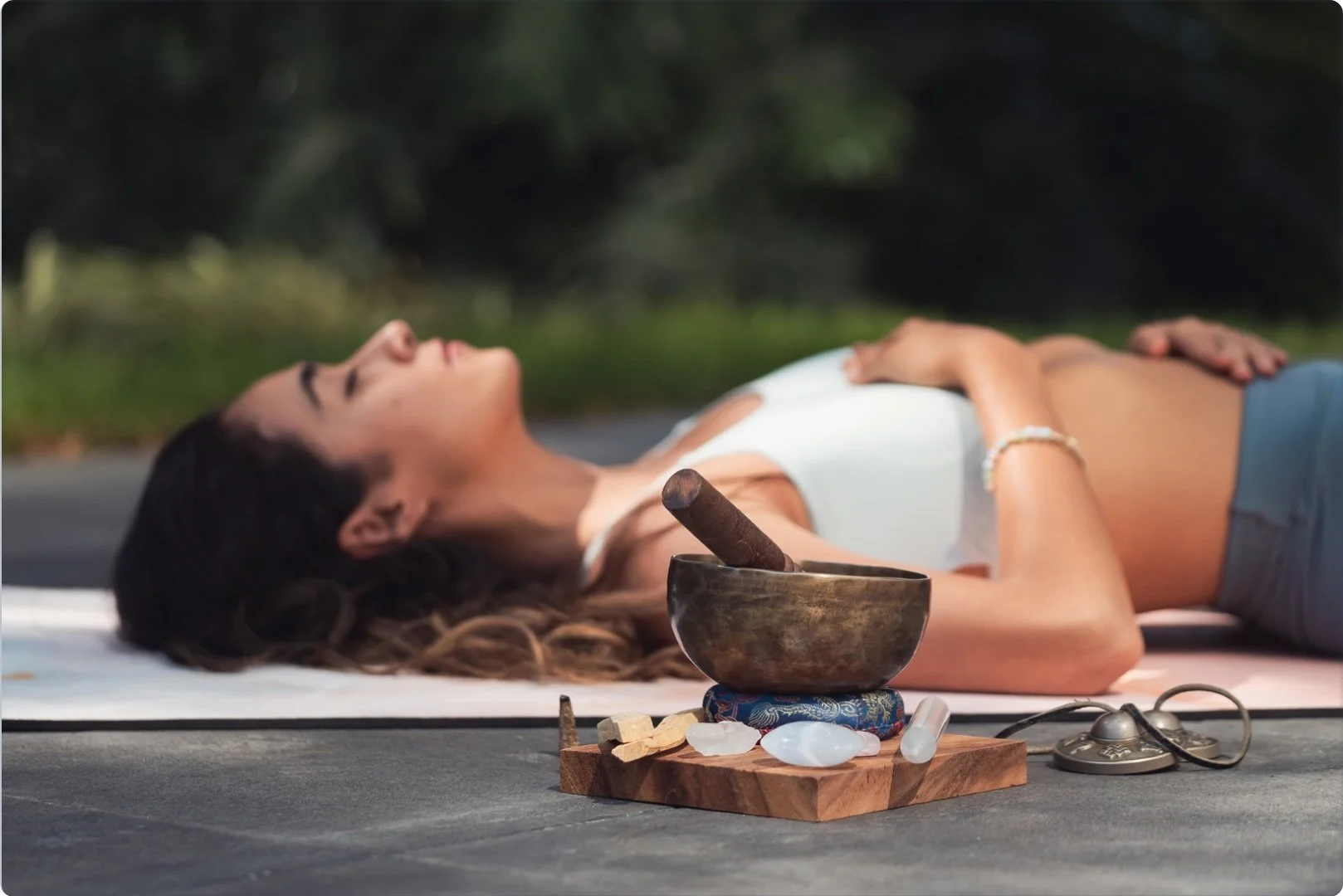 Yoga - woman in savasana with sound bowl.jpg