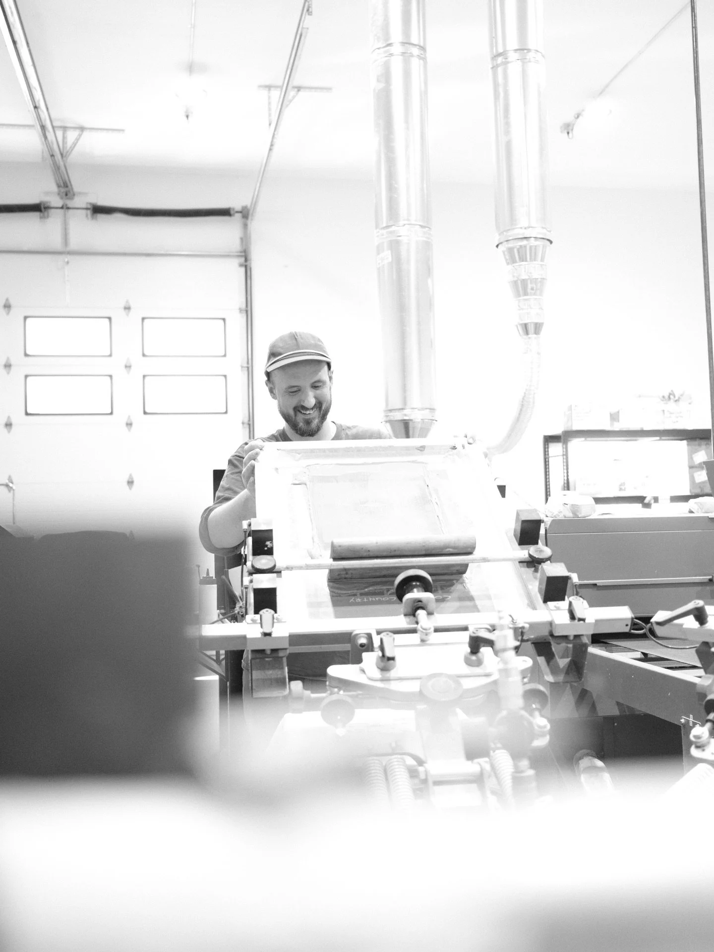 Everything we make gets the human touch. Ink on hands, eyes on every detail, no shortcuts.

Meet Ty, our Printing Lead 🧡
The guy making sure every print that leaves our shop actually deserves to.

Hand printed. Small batch or 2,400+. Always dialed.
