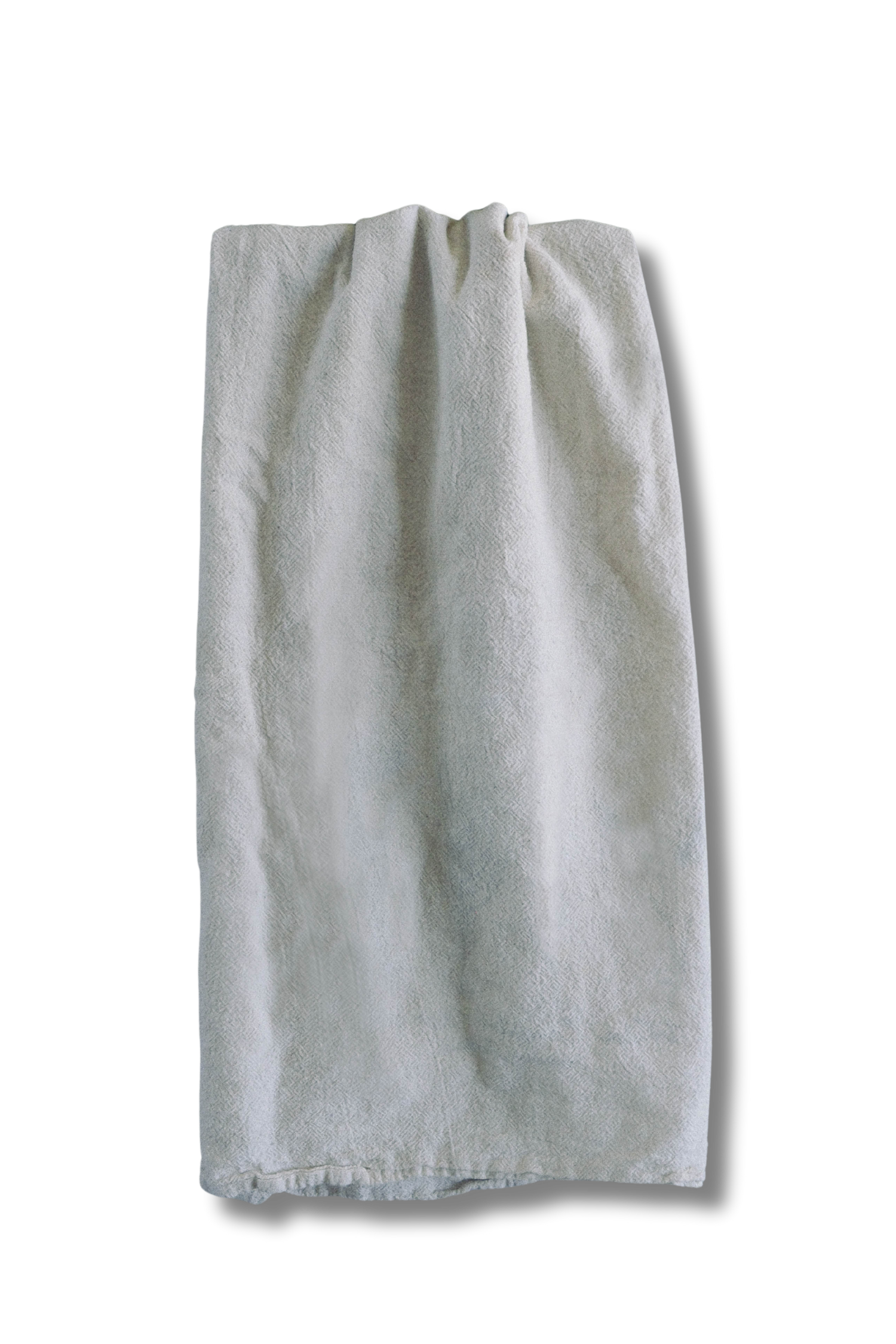 White towel hanging on a hook against a black background