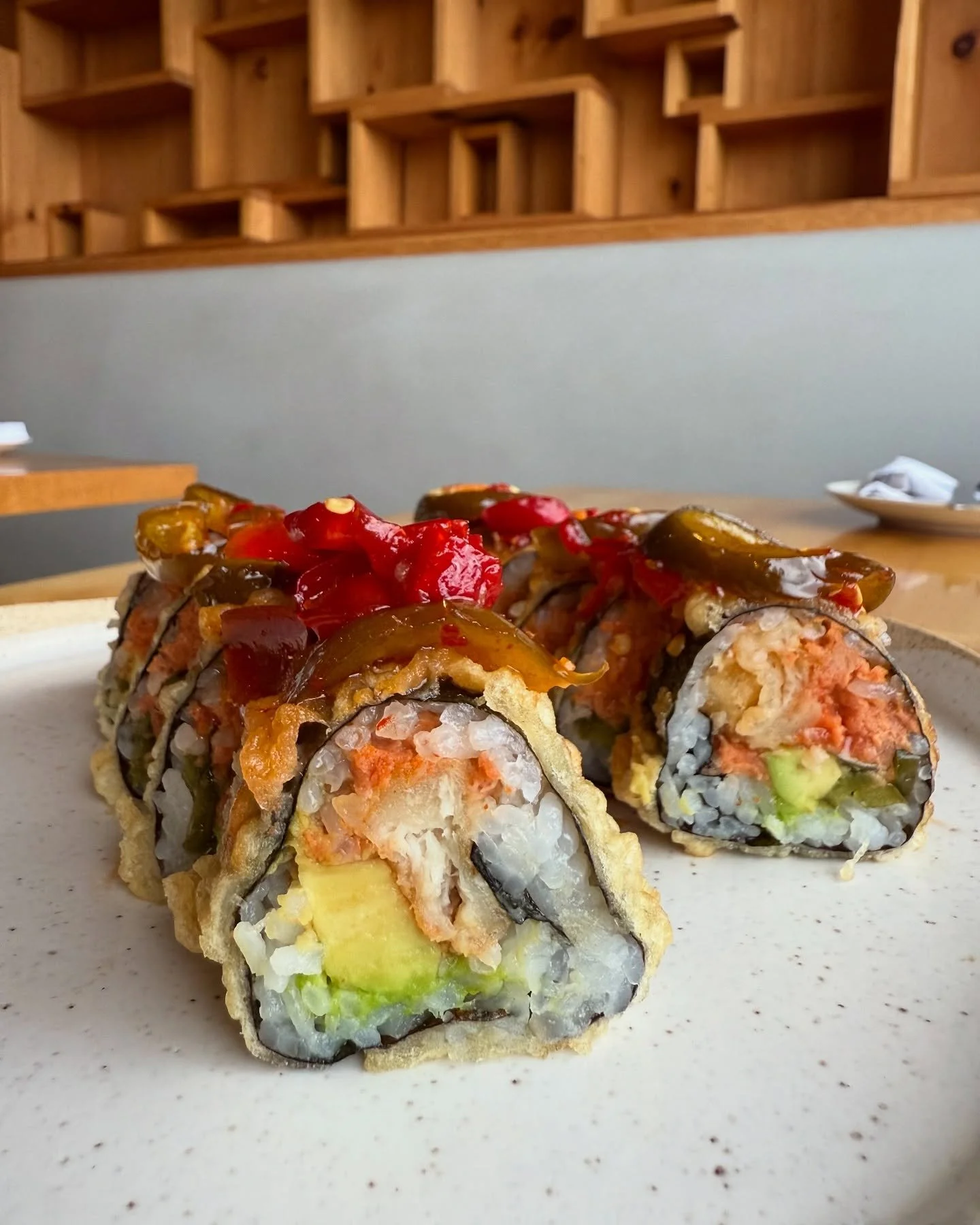 Scarapiello Roll - Spicy tuna, avocado, jalape&ntilde;o, tempura white fish; garlic, cherry peppers &amp; hot honey
