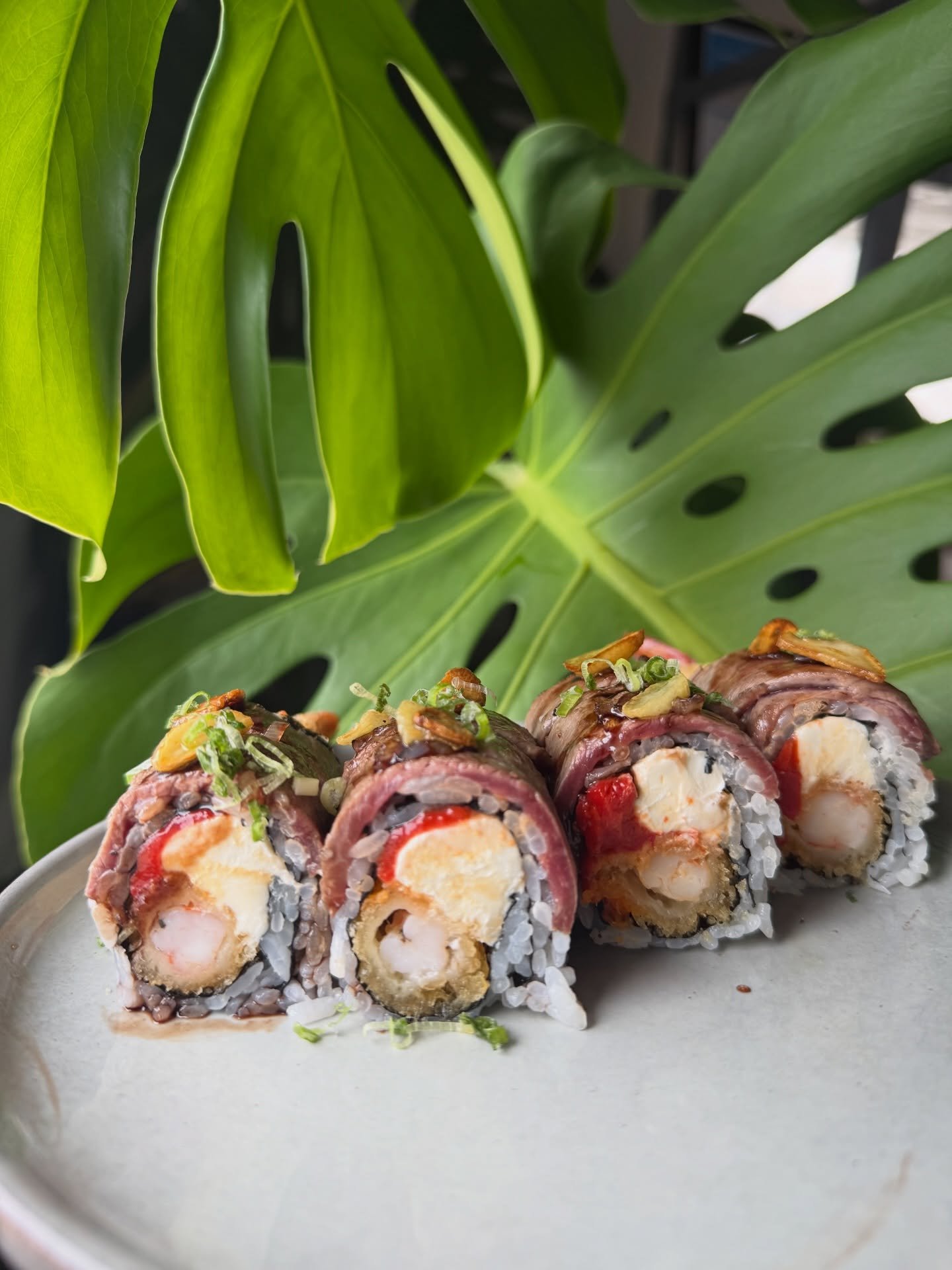 Tokyo Toscana Roll - Wagyu beef, roasted garlic, red wine soy reduction, mozzarella, roasted red pepper, shrimp tempura
