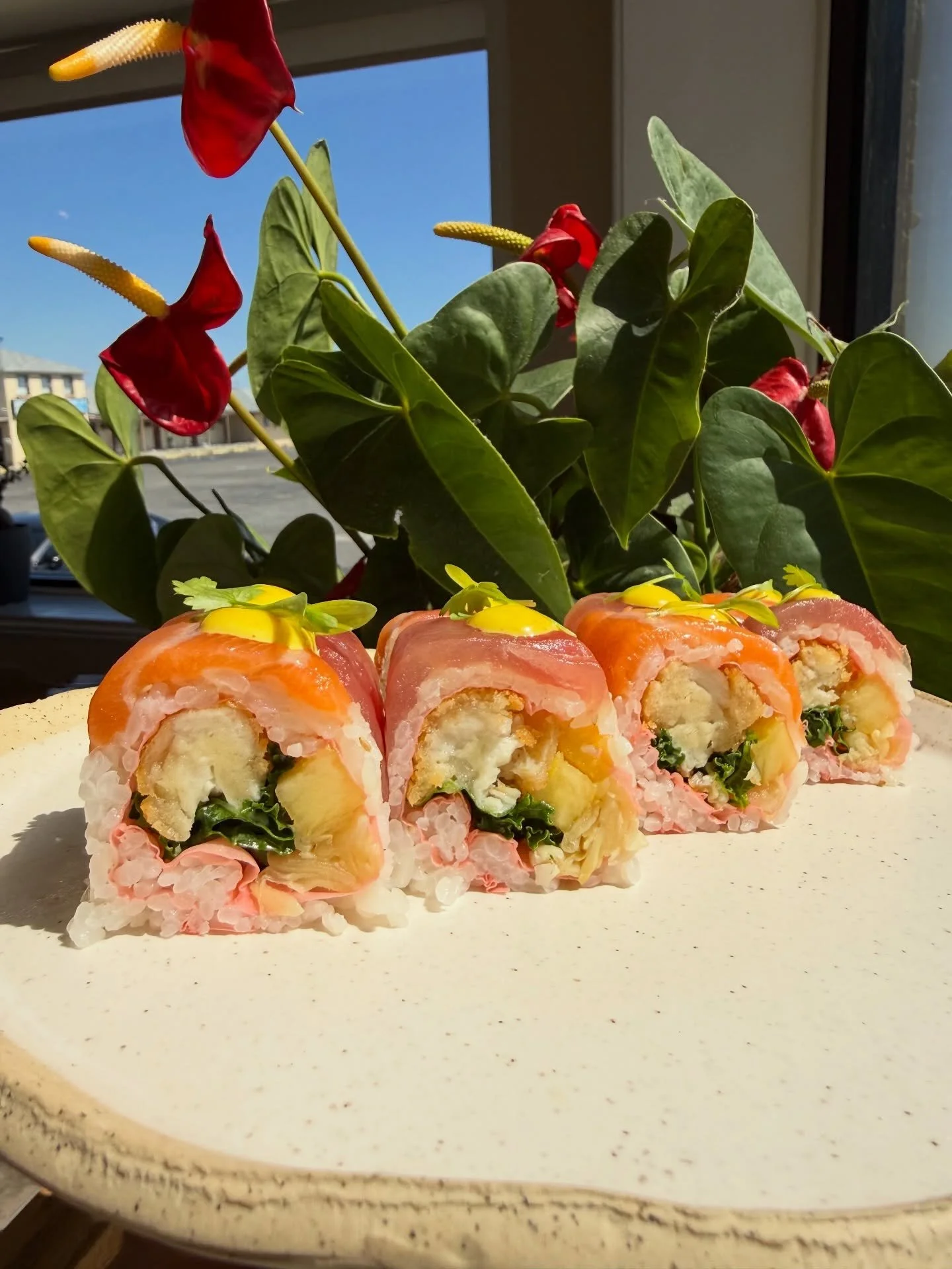 Beach Bum Roll - pineapple, ginger, kale, Chilean seabass topped with tuna, salmon &amp; turmeric aioli