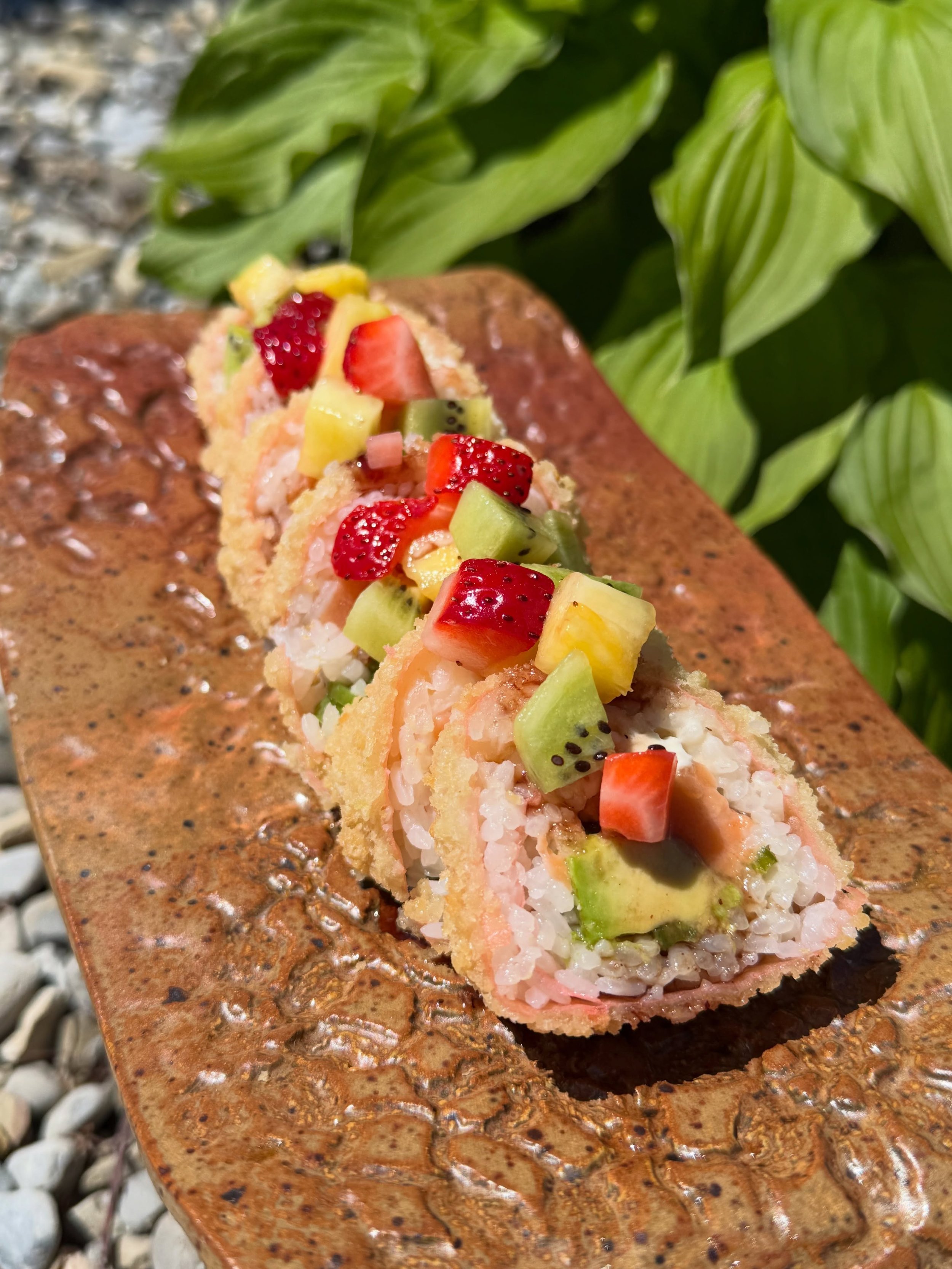 Gol Tong Roll - spicy salmon, cream cheese, avocado, jalape&ntilde;o; kiwi, pineapple, strawberry, grape soy reduction