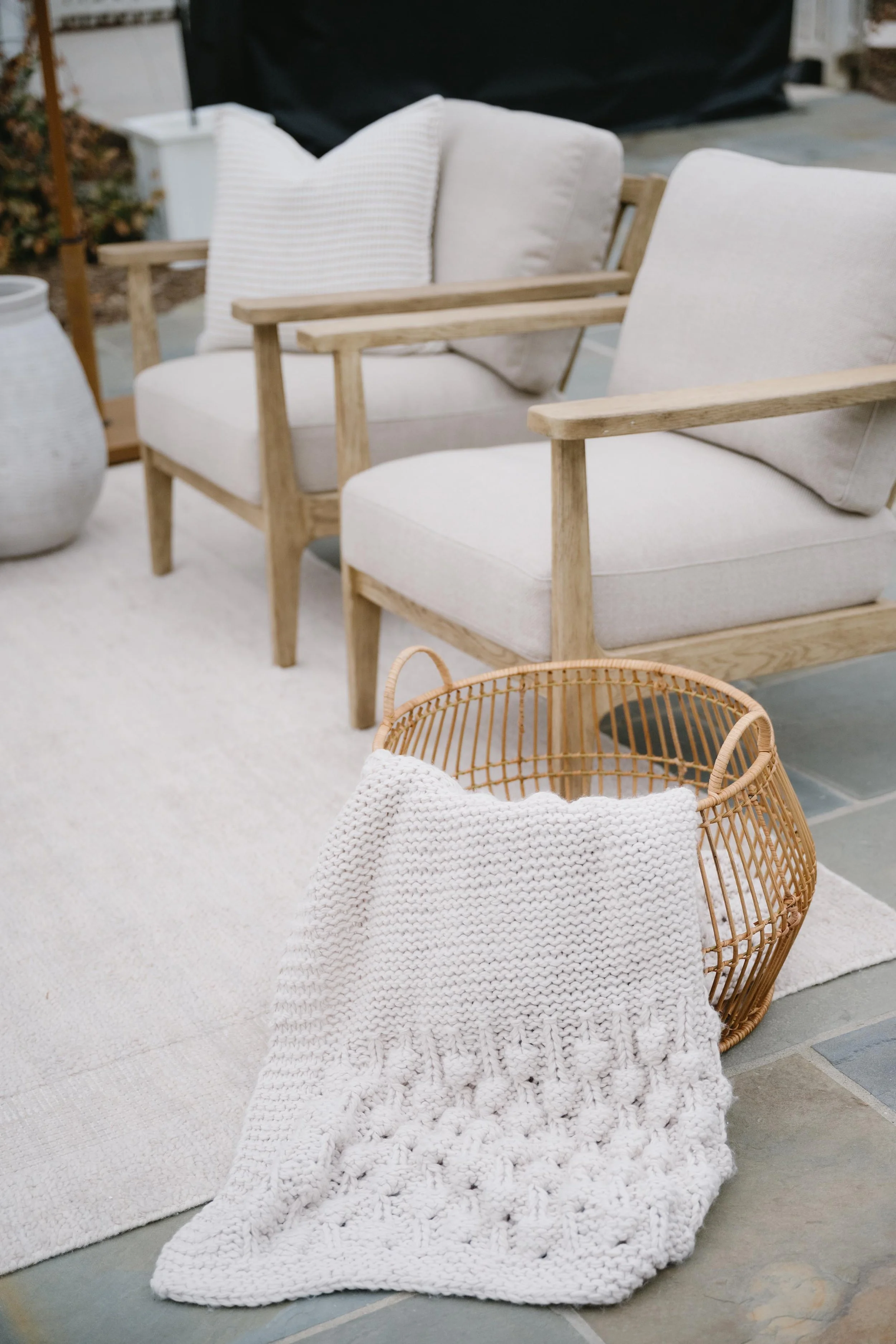 basket with blanket draped over