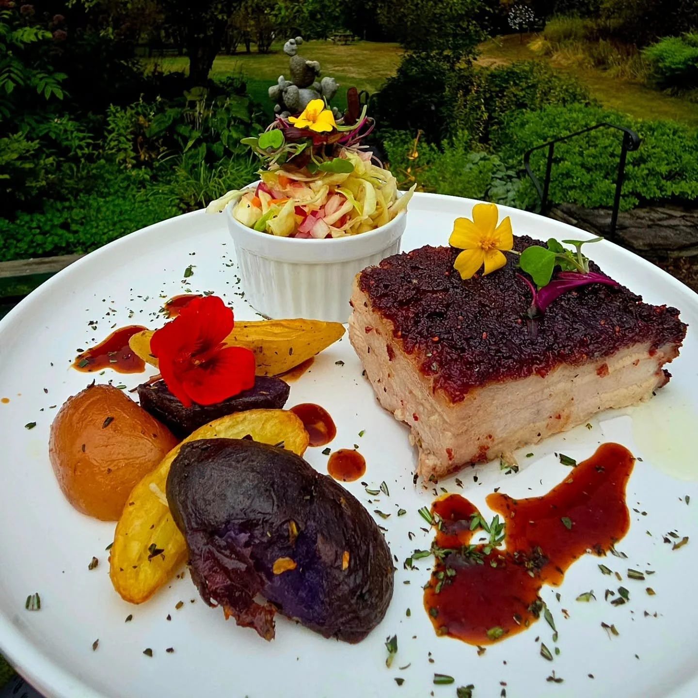 Cranberry encrusted @champlainfarms Pork Belly, slowly roasted in cranberry, maple syrup &amp; rosemary accompanied by roasted fingerling potatoes topped by @jasperhillfarm clothbound cheddar &amp; @mcdonaldfarmstand cabbage slaw