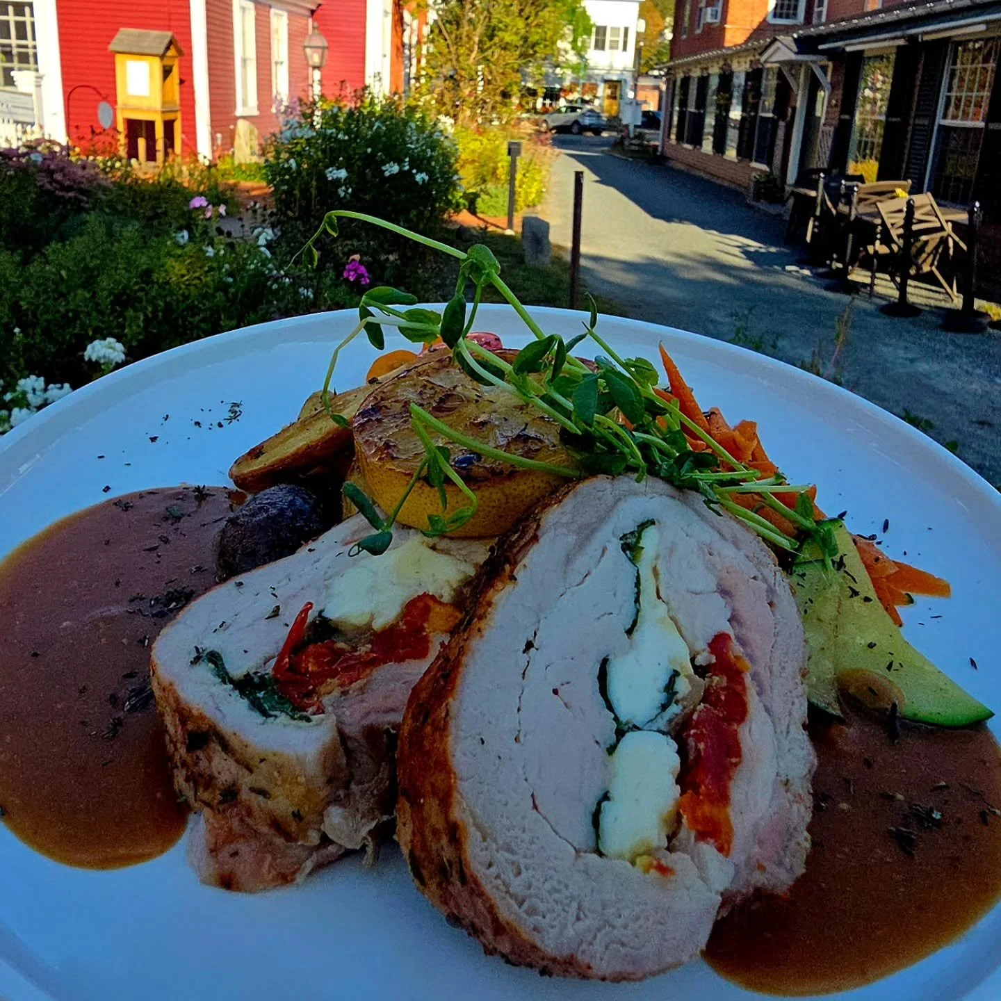 VT Raised Pork Roulade, @maplebrookfarm feta cheese, wilted spinach, carmalized onions, sun-dried tomatoes, whole grain mustard &amp; cognac demi glace, herb roasted potatoes, zucchini, carrots , griddled lemon &amp; pea shoots. 

@mcdonaldfarmstand