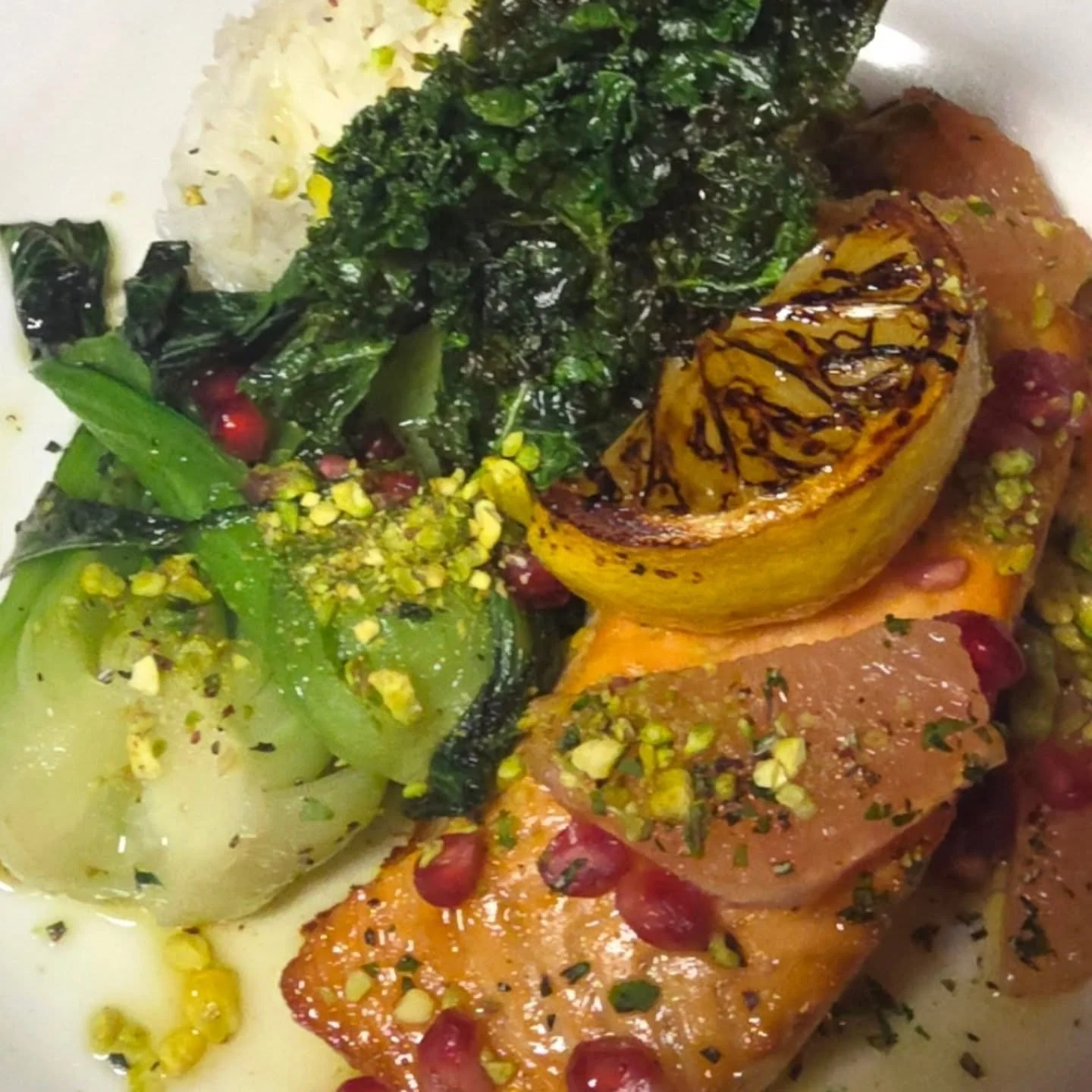 Cedar Plank Salmon, pomegrante seeds, grapefruit, toasted pistachio's, extra virgin olive oil, jasmine rice, fried kale &amp; bok choy
